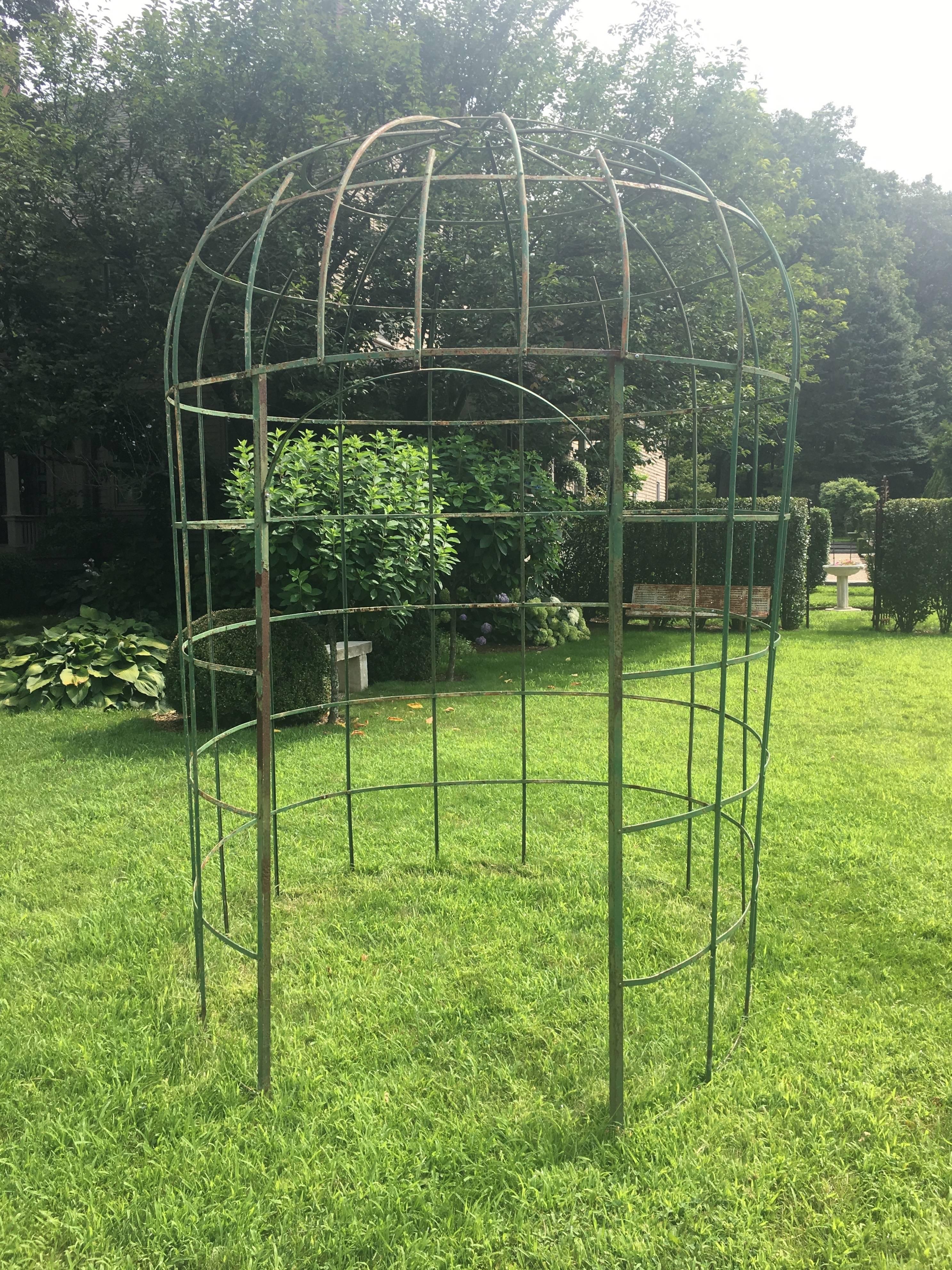Now here is a rare piece! Handmade from wrought iron in the late 19th century, this wonderful lattice design garden structure is known in France as a Gloriette, but we call it a gazebo. This one, however, has a domed top and an open and airy design