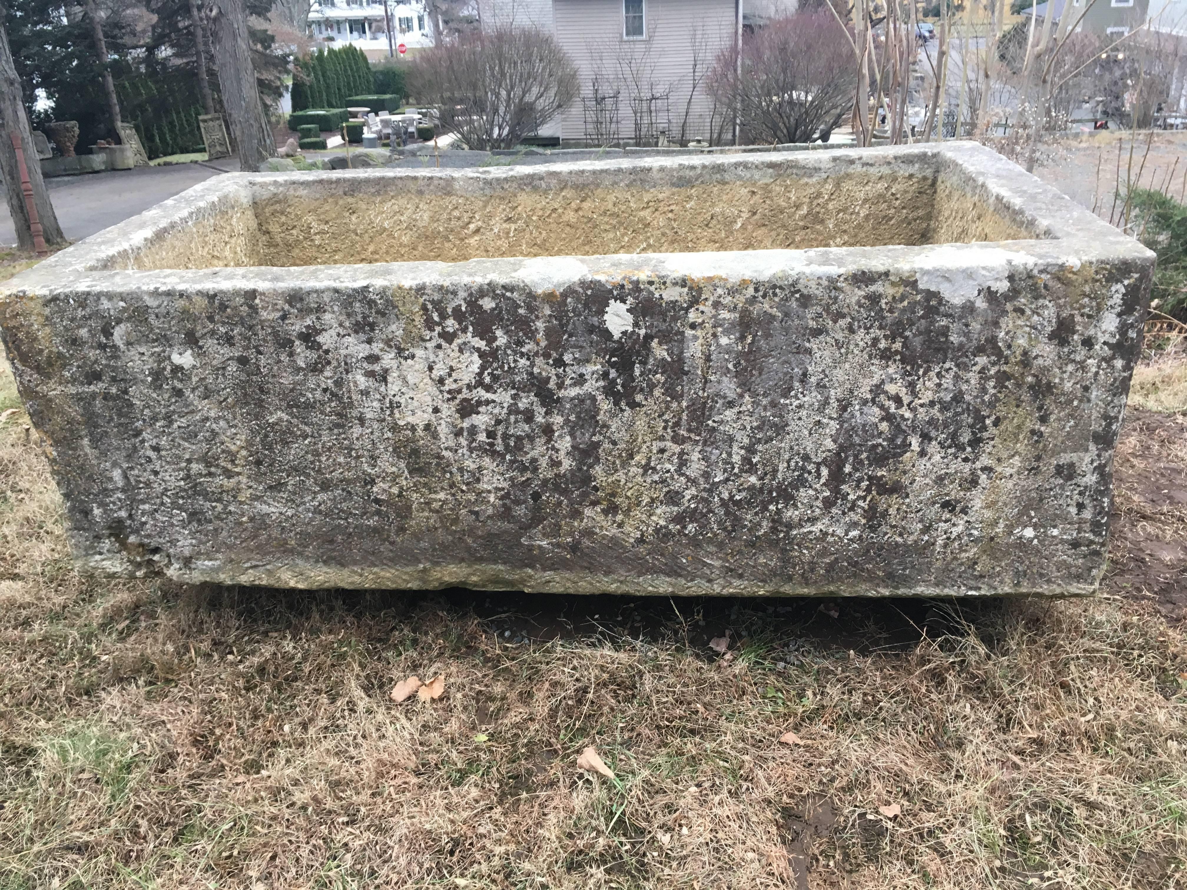 Dating to the late 18th century and hand-carved from a hard limestone, this stunning rectangular trough is superb in all respects: size, patina, condition, and age. It would make the perfect wall fountain, or look equally well with a profuse