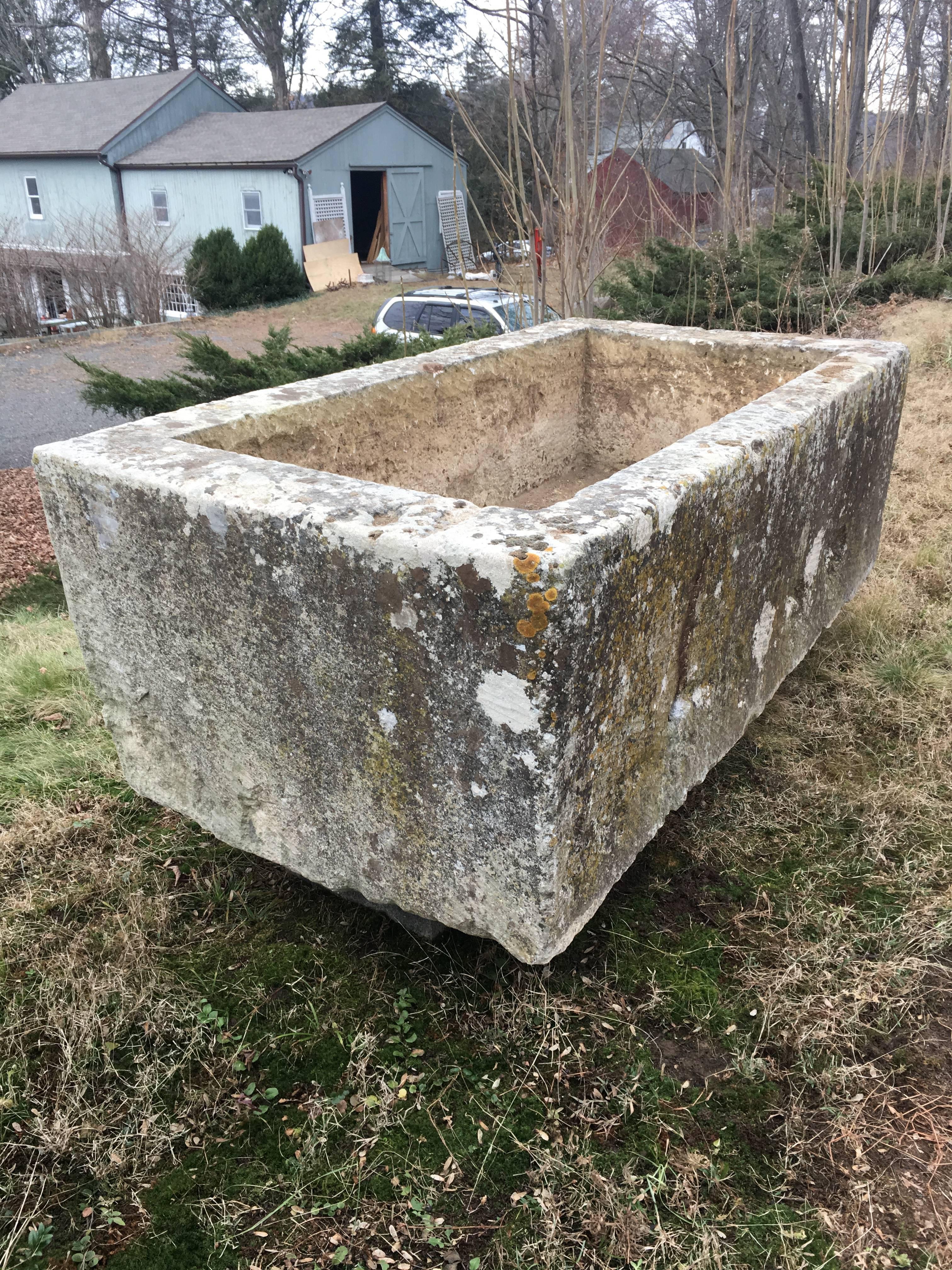 This enormous hand-carved hard limestone trough dates to the late 18th century and is perfection personified. With its gorgeous patina and in superb condition, it features 3