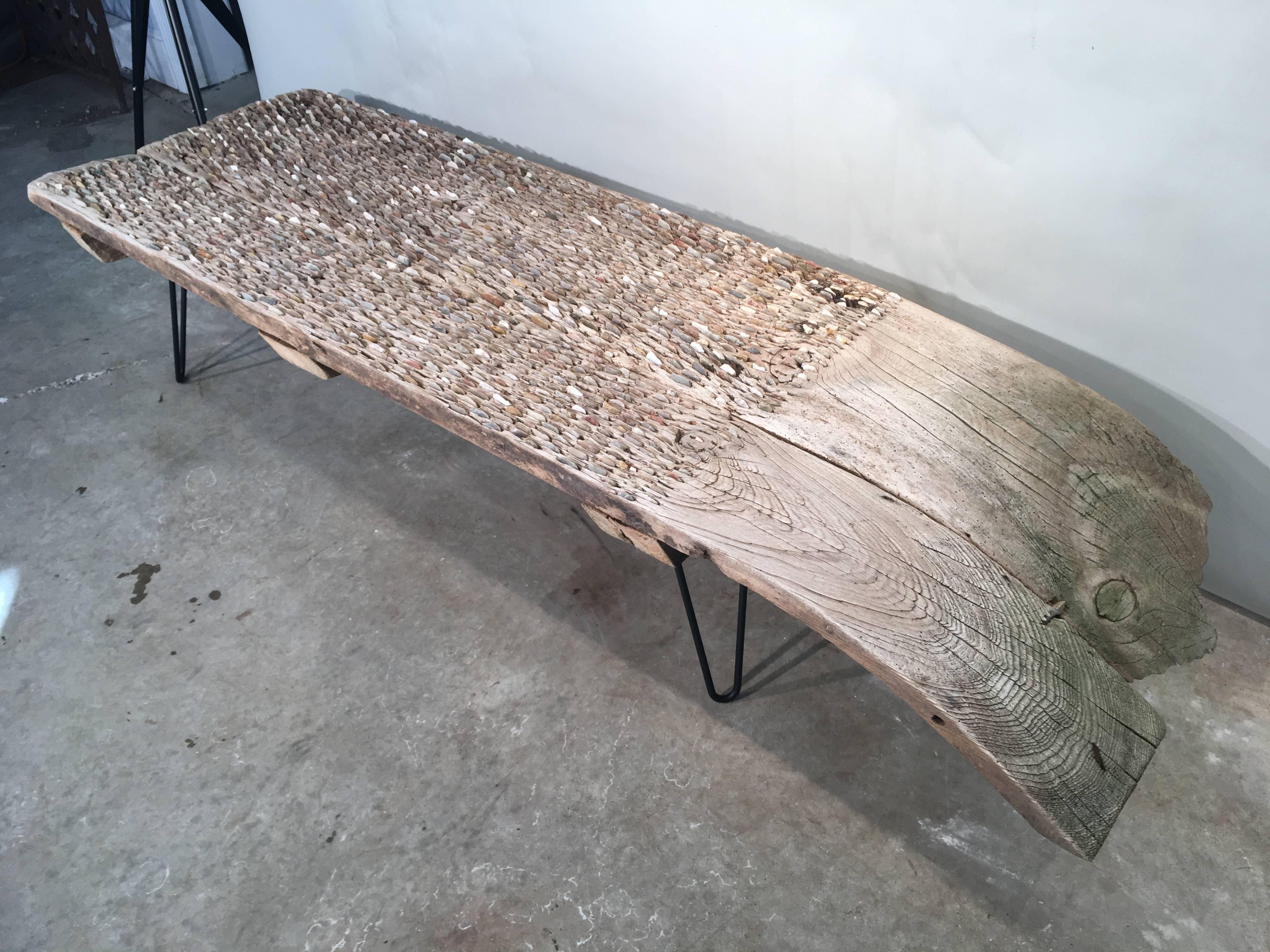 A tribulum is an ancient hand-made threshing board, inlaid with chips of flint or stone, that has been used since Roman times to separate grains from the chaff. We were fortunate enough to score two of these coffee tables, this one in a lovely pale