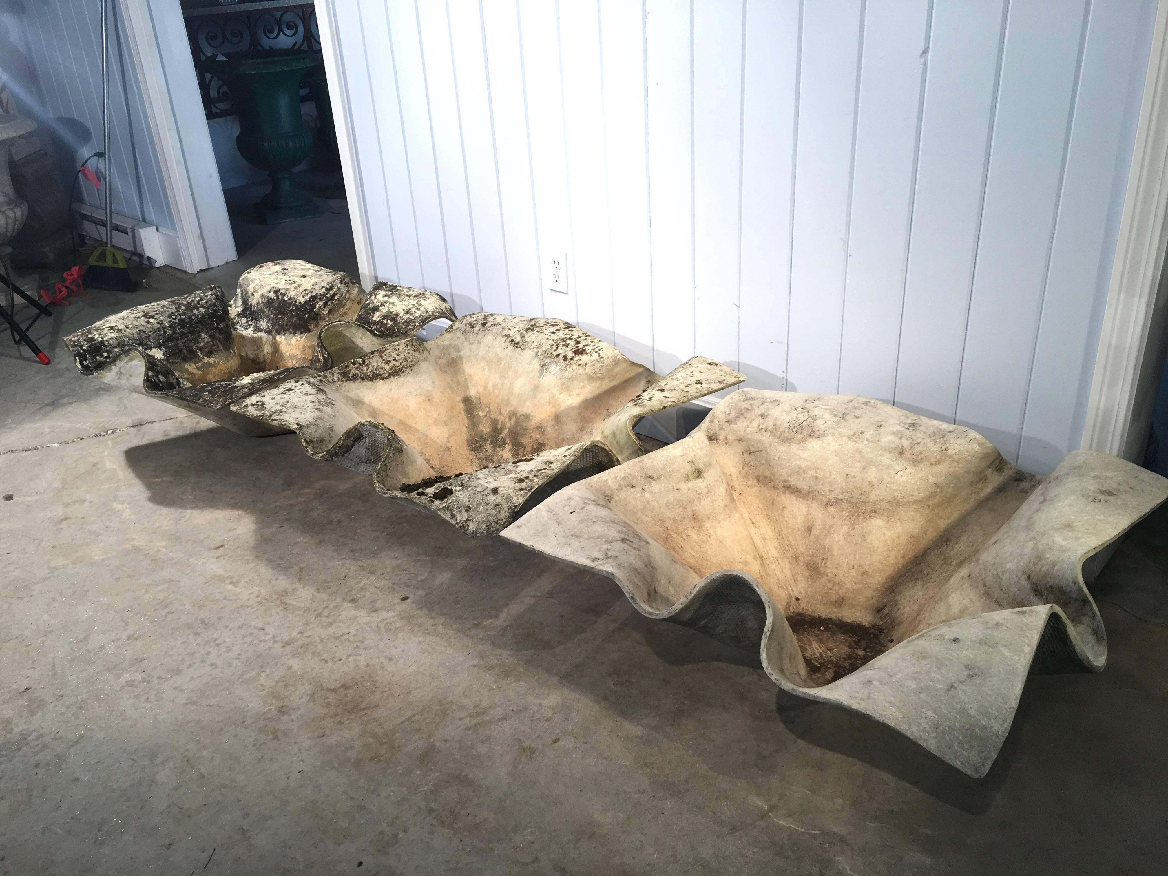 Designed by the iconic Willy Guhl, and manufactured by Eternit, SA of Switzerland, these massive and distinctive elephant ear planters each has a different weathered surface. They will make an exceptional architectural statement in your contemporary