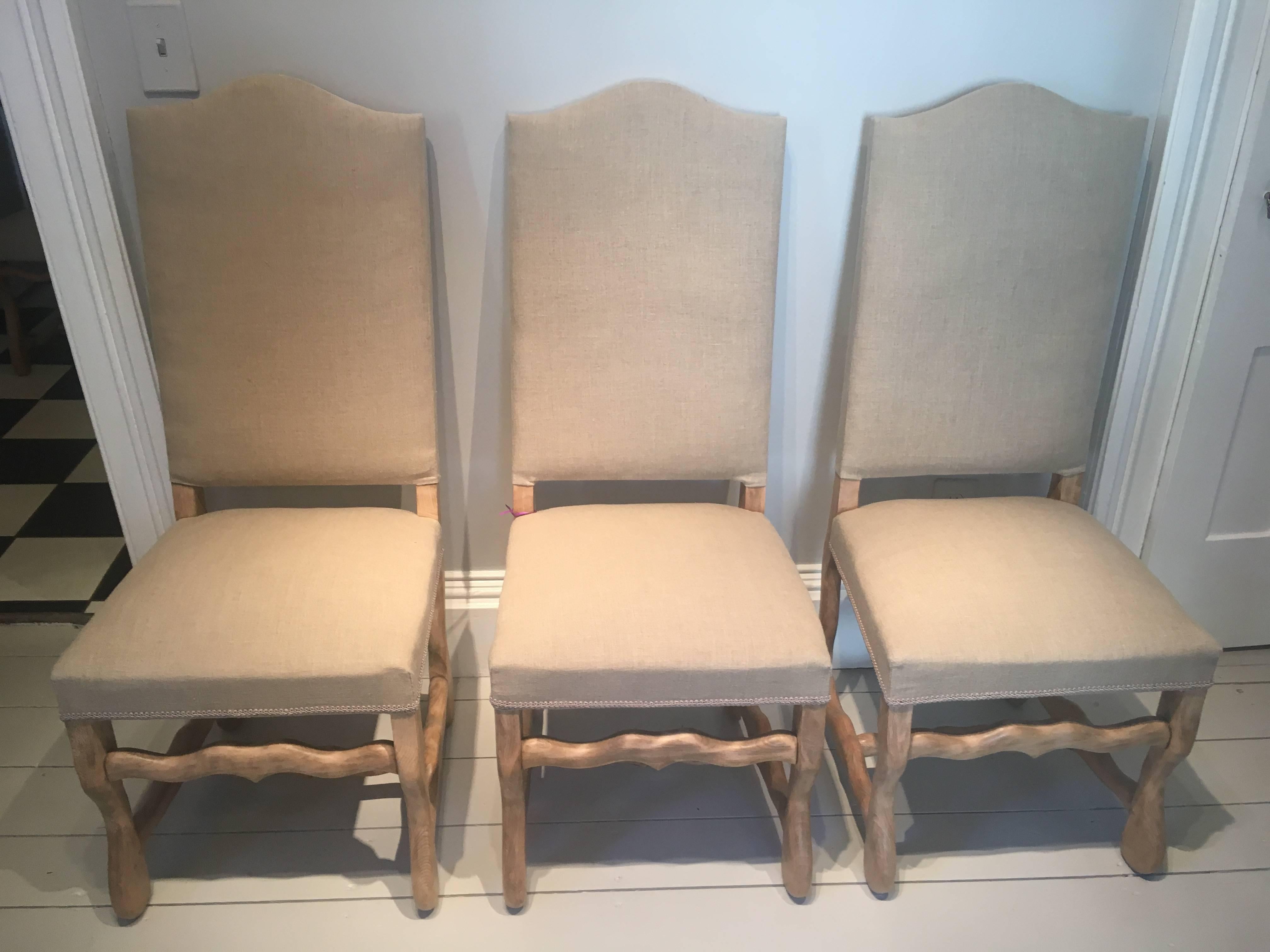This set of six Os de Mouton chairs is all handmade from beech and dates to the late 19th C. With very desirable "Chapiteau du Gendarme" arched tops, the beech legs have been stripped and waxed to achieve a warm, pale color that is