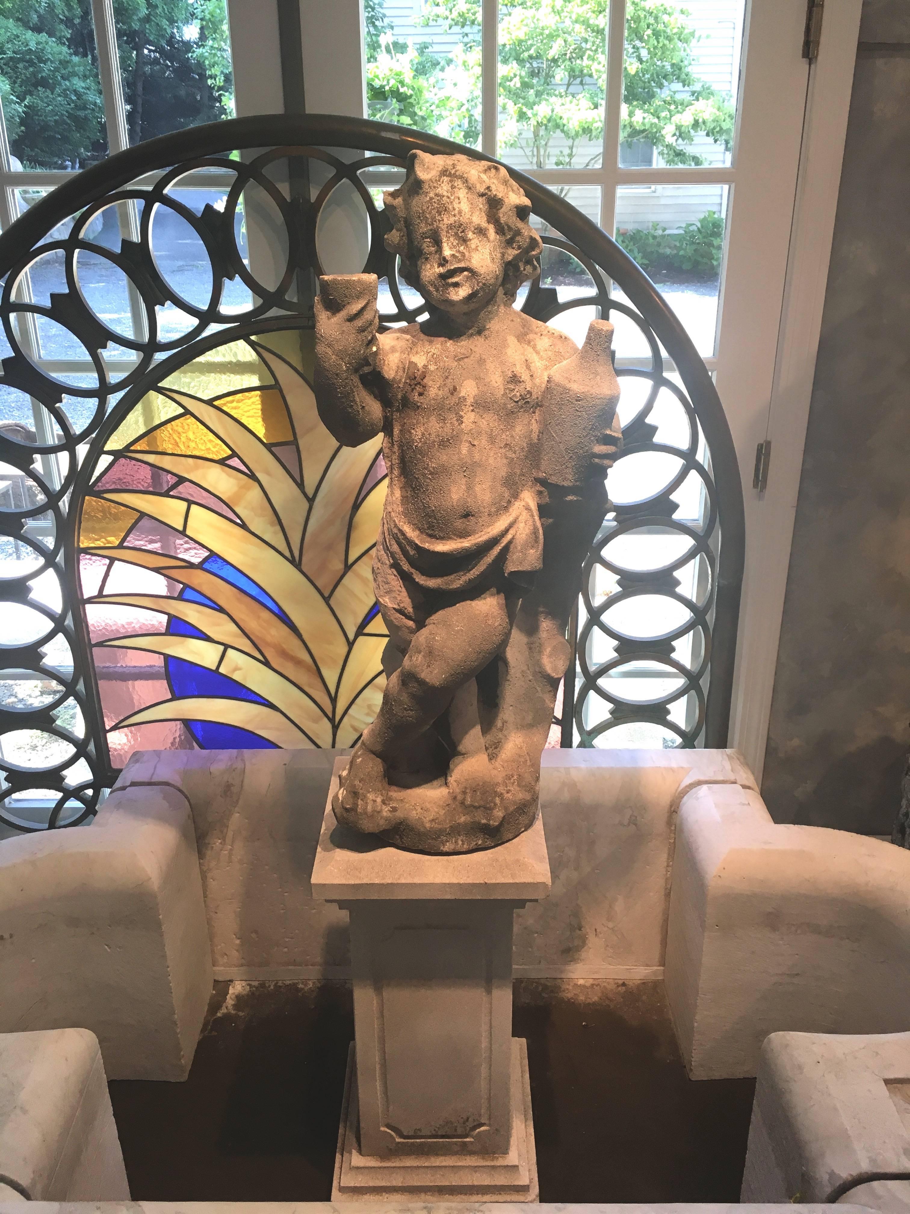 From a magnificent Chateau in the Loire Valley of France, this beautifully-carved 18th century statue of Dionysus as a youth will delight you. Holding a cup aloft and grasping a bottle of wine, he stands in an insouciant pose with a mischievous grin