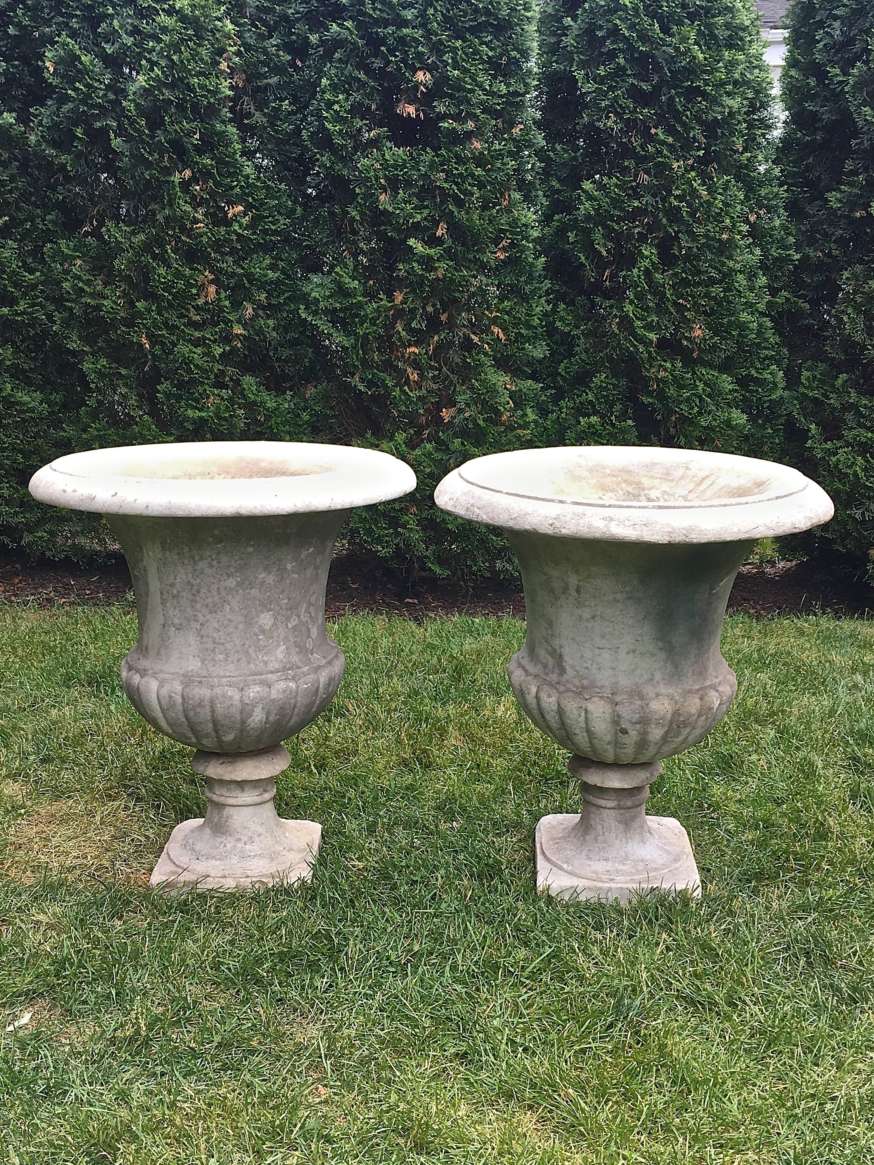 This pair of campana-form urns is just fabulous! With classical quarter-lobed body and plain everted rims, they were originally intended to stand alone and, as such, have a modest planting well (8