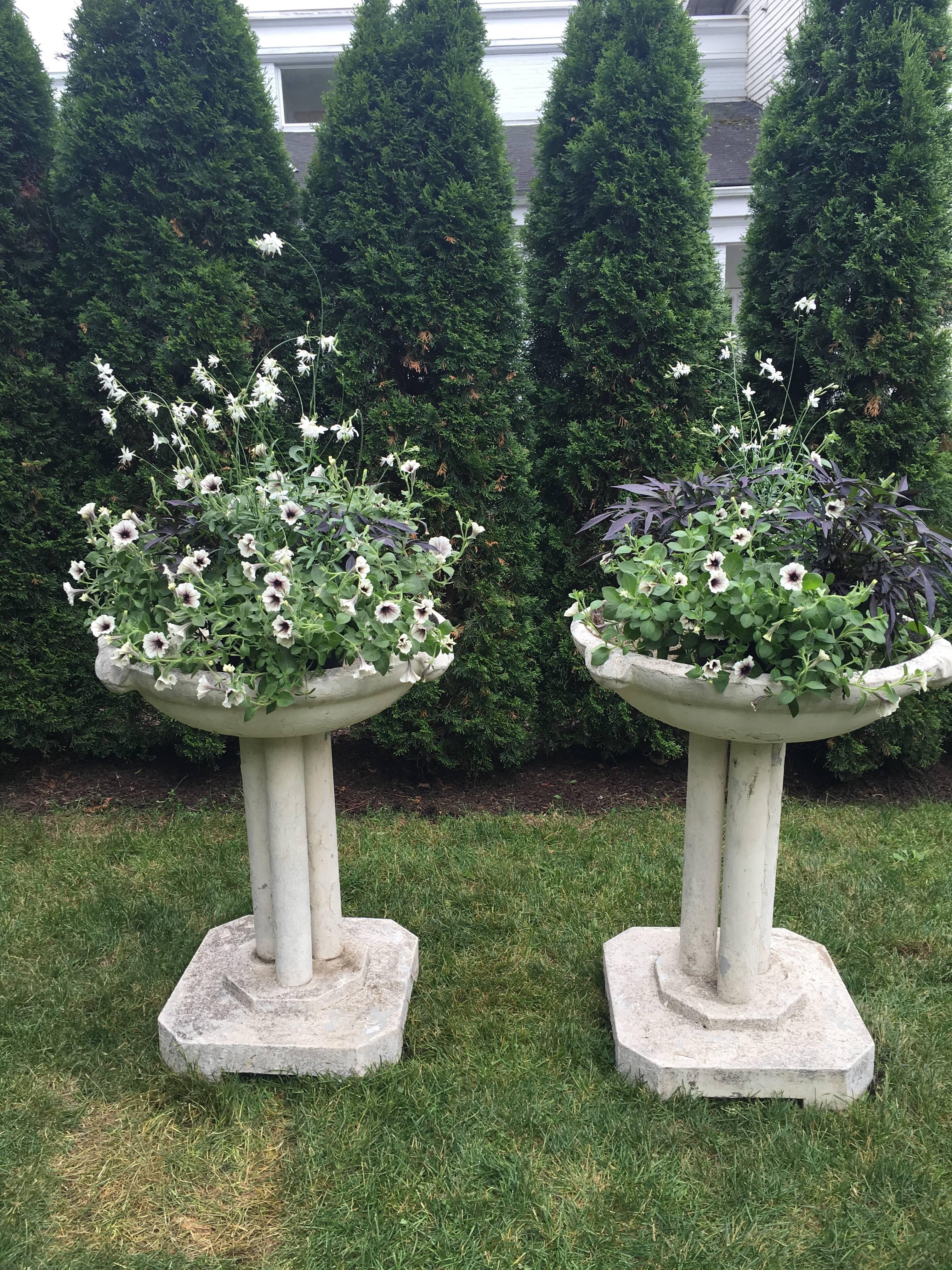 This cast stone font has it all! Worn pale cream-colored paint, mossy edges, good depth, stunning form, and great presence. Its superb height makes it a prime candidate for a focal point in your garden or on the terrace. With great versatility, it