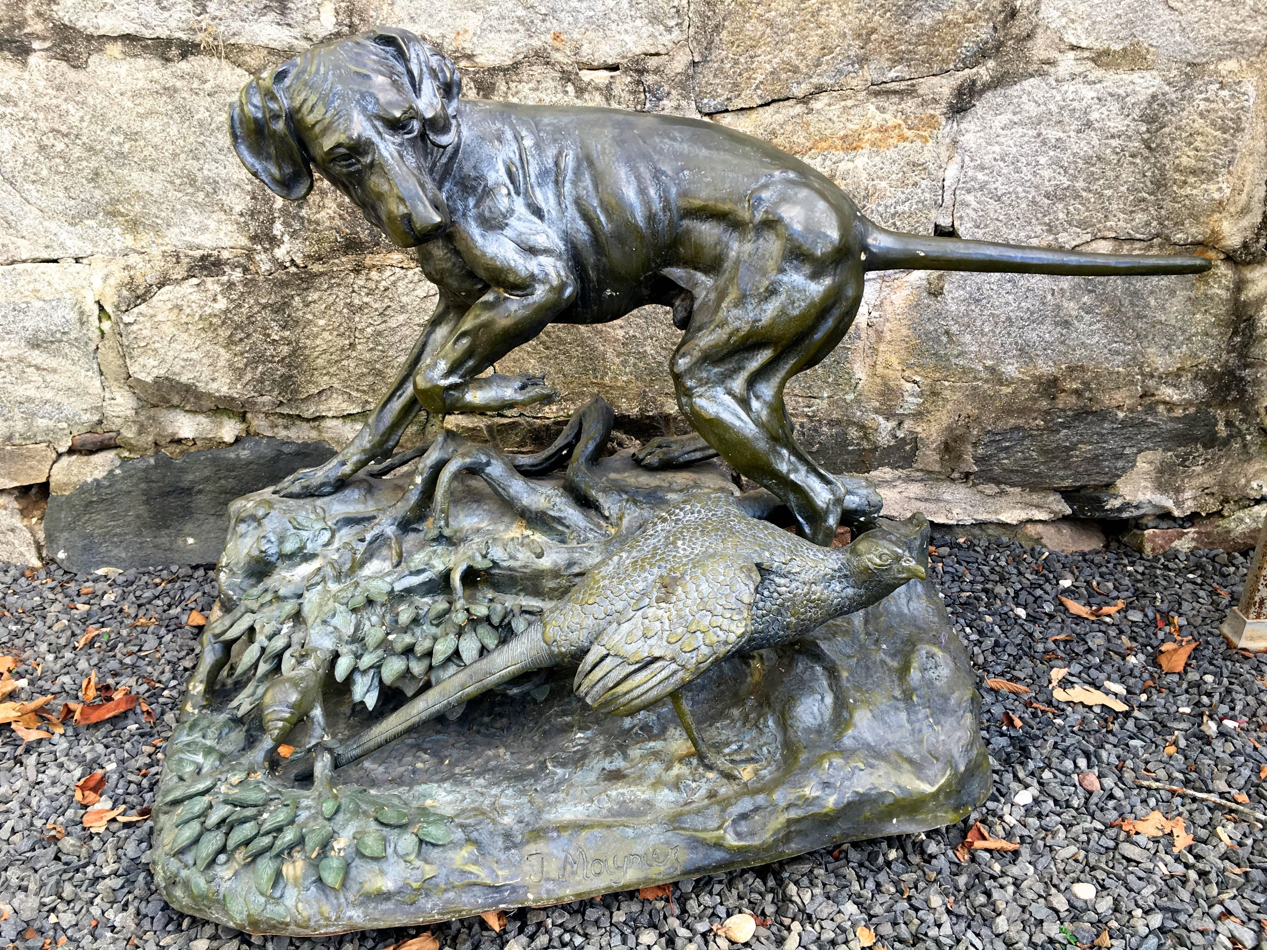 This late 20th century bronze re-cast of the famous Moigniez sculpture, Pointer dog with pheasant, is beautifully-done with sharp casting, wonderful dark-greenish-bronze patina, and is in excellent condition. Perfect as a statement piece, indoors or