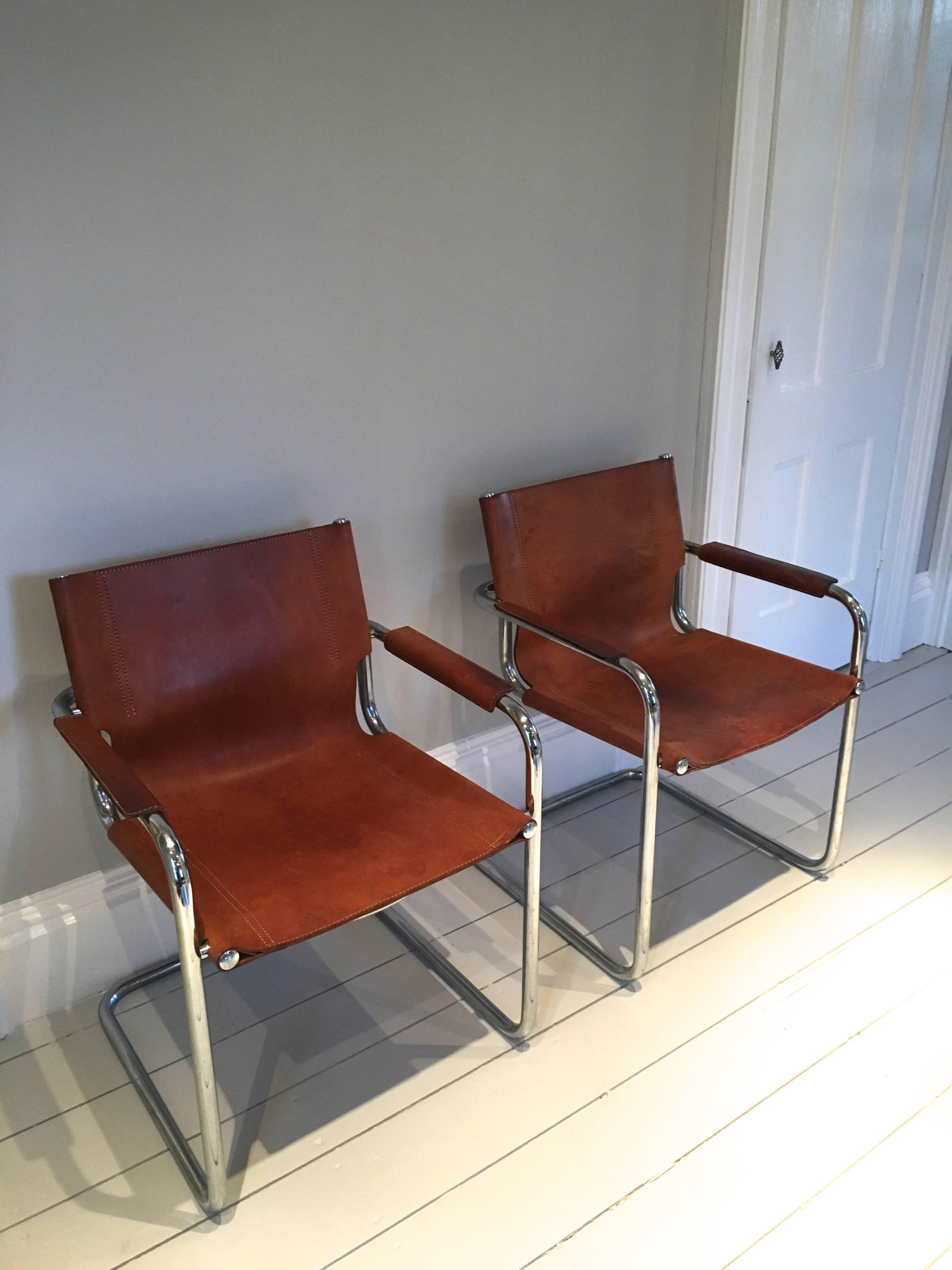 We love these chairs for their softly-worn leather, enduring comfort and small apartment-friendly size. The cognac leather and frames are in lovely condition and the leather patina has great depth and character. Derived from the original S34