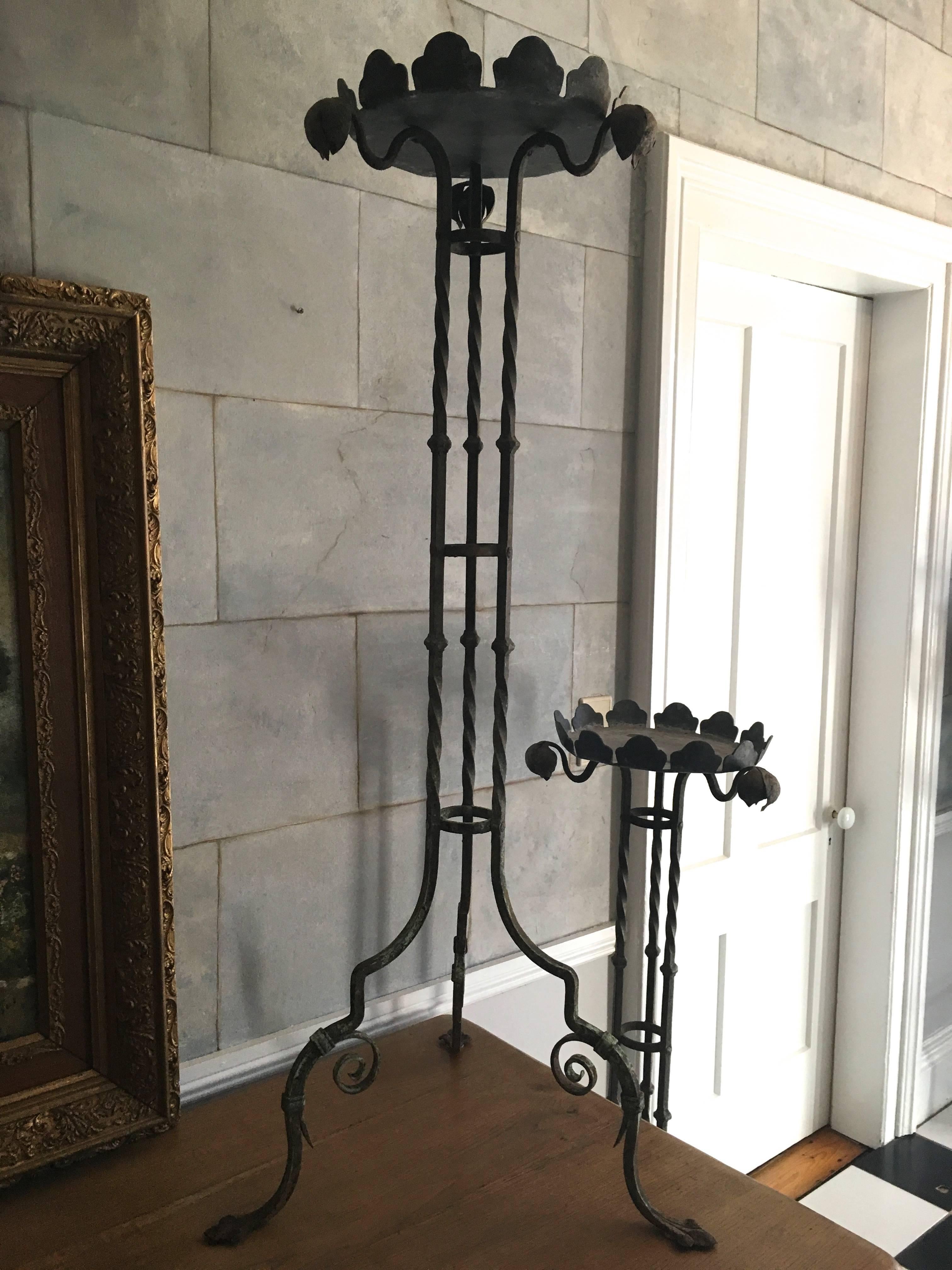 The delicate, elegant form of these stands is one that will do any traditional home or garden proud! Handmade of wrought iron, riveted, and with removable lead pans that sit on top, these stands were originally intended to hold plants, but we