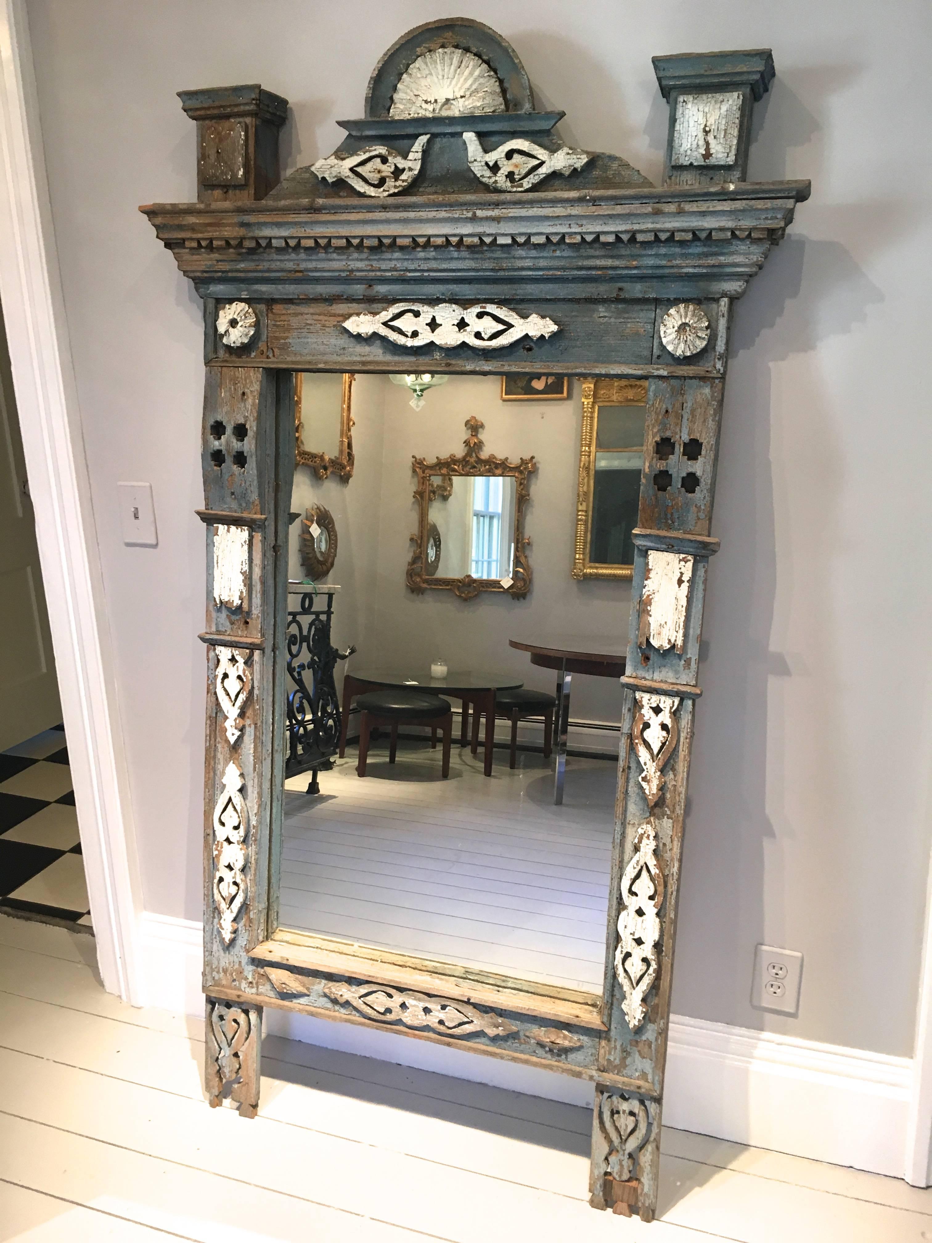 This gorgeous painted wooden frame has appliquéd doves, a center demilune, corner rosettes and additional decoration to the solid pine frame. The color is a stunning faded blue with minor areas where the original wood shows through and the white