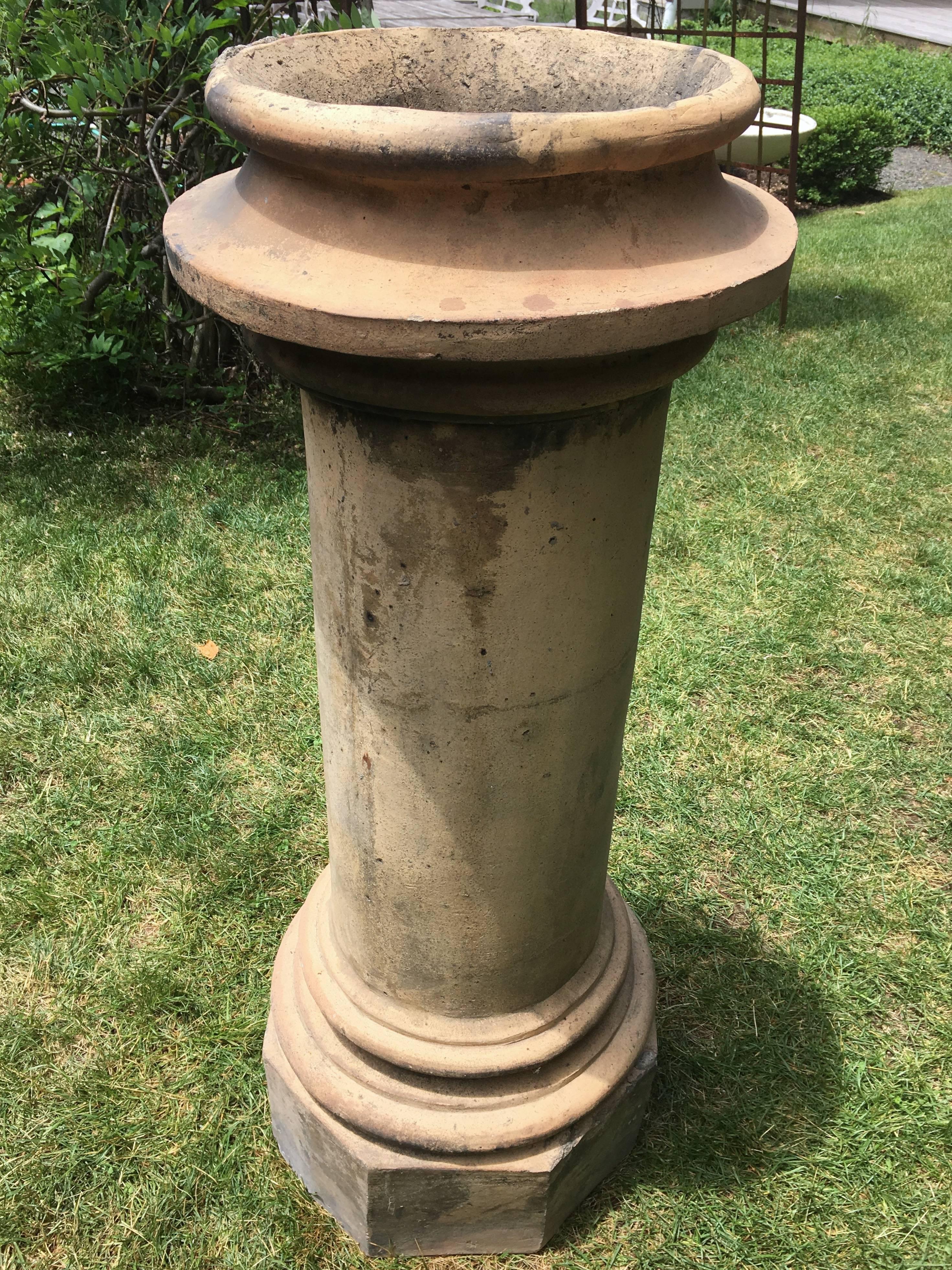 Rare because of its size, this hand-thrown terracotta chimney pot was removed from an enormous building in the Southeast of England near Kent. It would make a wonderful focal point in the center of a garden, and is just the right size to hold a