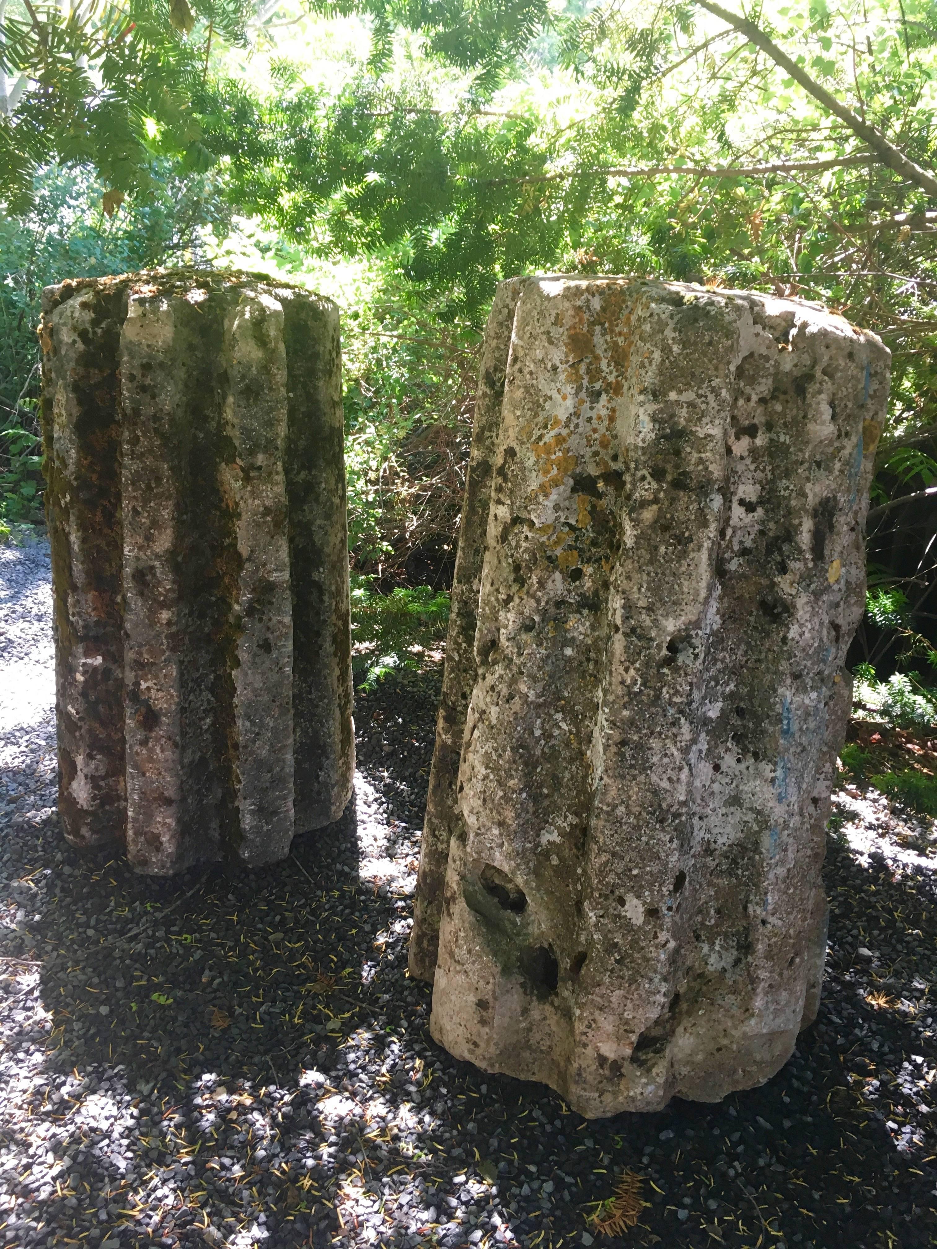This fabulous and elegant pair of hand-carved limestone "cannelles" were originally used to grind wheat in the 18th century and are named "cannelles" after the same-shaped little cinnamon cakes made famous by Bordeaux