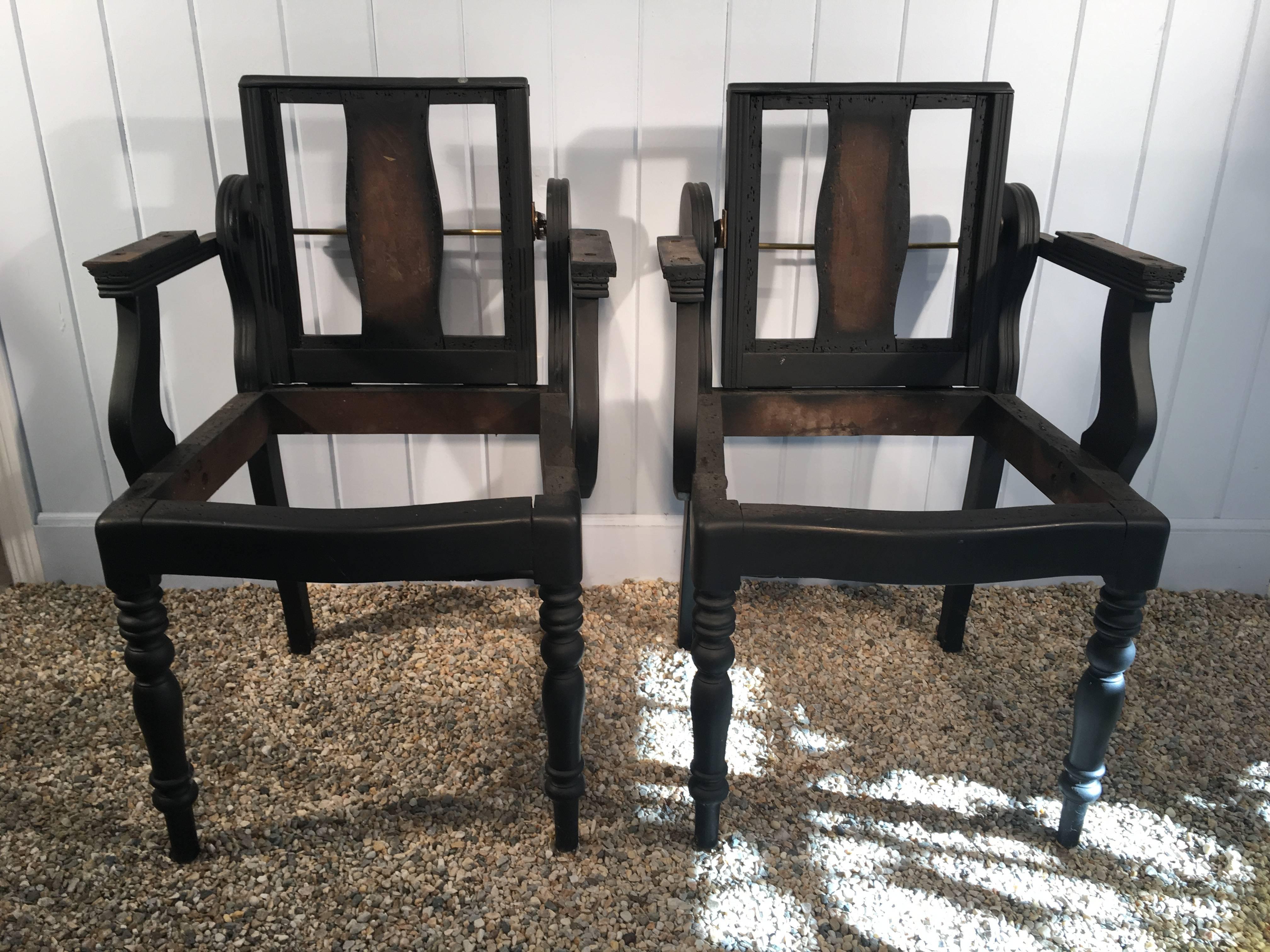 We love these chairs for their unusual sculptural form, reclining backs and original brass and steel towelracks. When we first bought them, they were a mess, but did have layers and layers of decrepit leather and horsehair stuffing, so we knew them