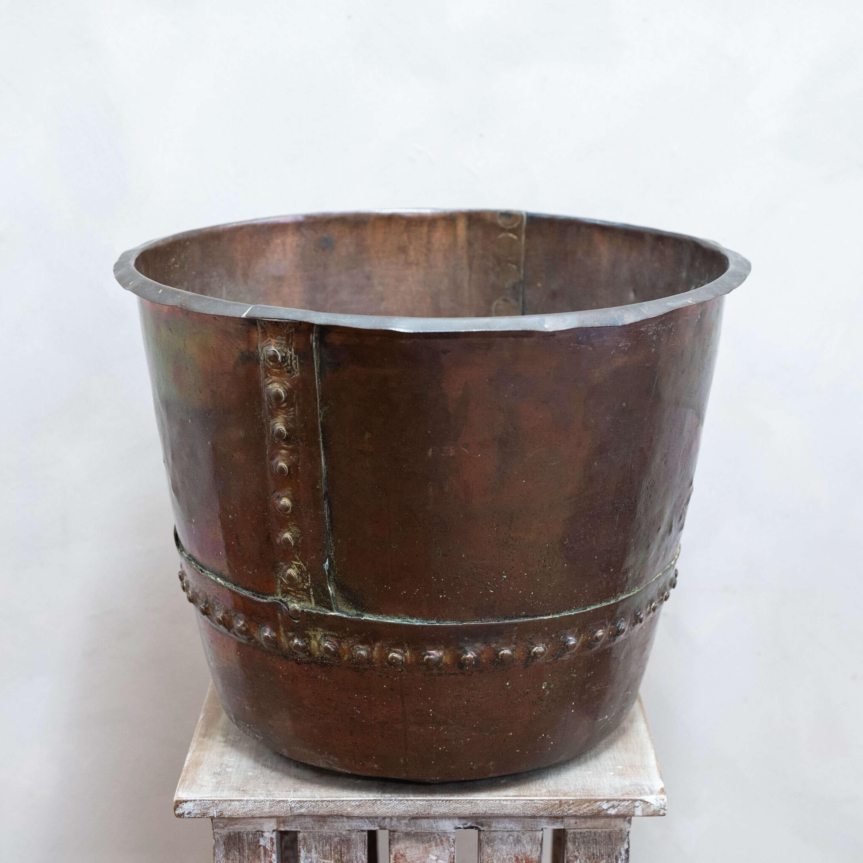 An English Riveted Copper Cauldron with great patina.
Suitable for planting or log storage.

England, circa 1890.

Height - 39.5 cm
Diameter - 51 cm
Please message if any further info or photos are required 
SHIPPING
The quotes shown are automated