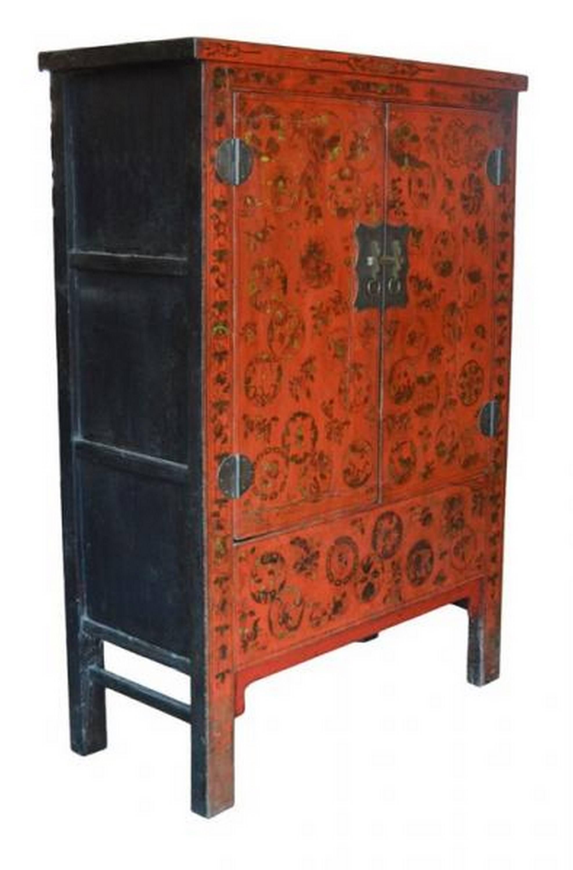 Antique Chinese red lacquer cabinet or armoire, with gold / brown chinoiserie accents, original traditional brass hardware, two interior drawers.