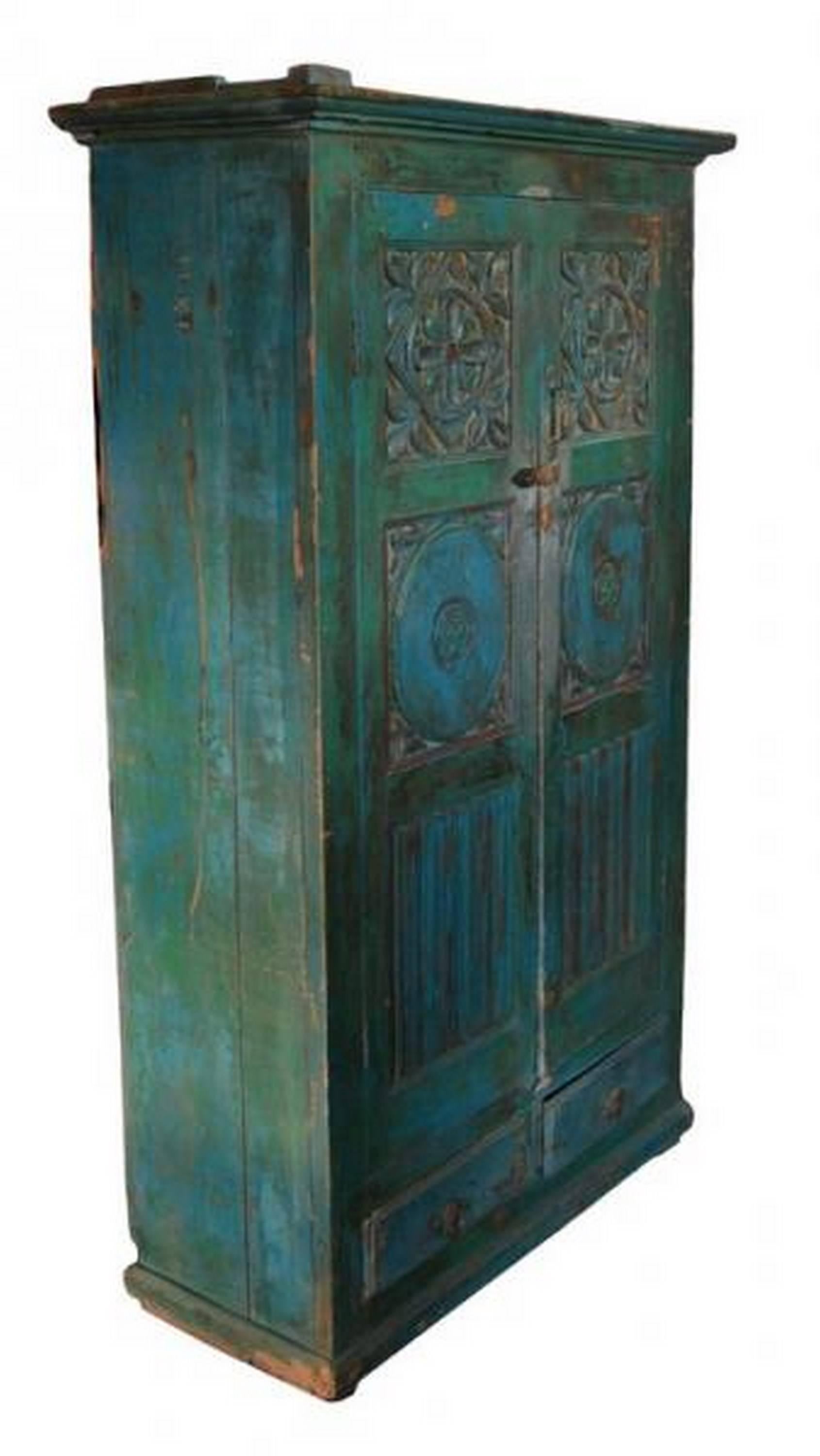 An early 20th century Indian painted cabinet with traditional hand carved motifs.  This painted hand-carved floral motifs cabinet comes from Goa, India, which was a Portuguese colony for 450 years until it was annexed by India in 1961.  This