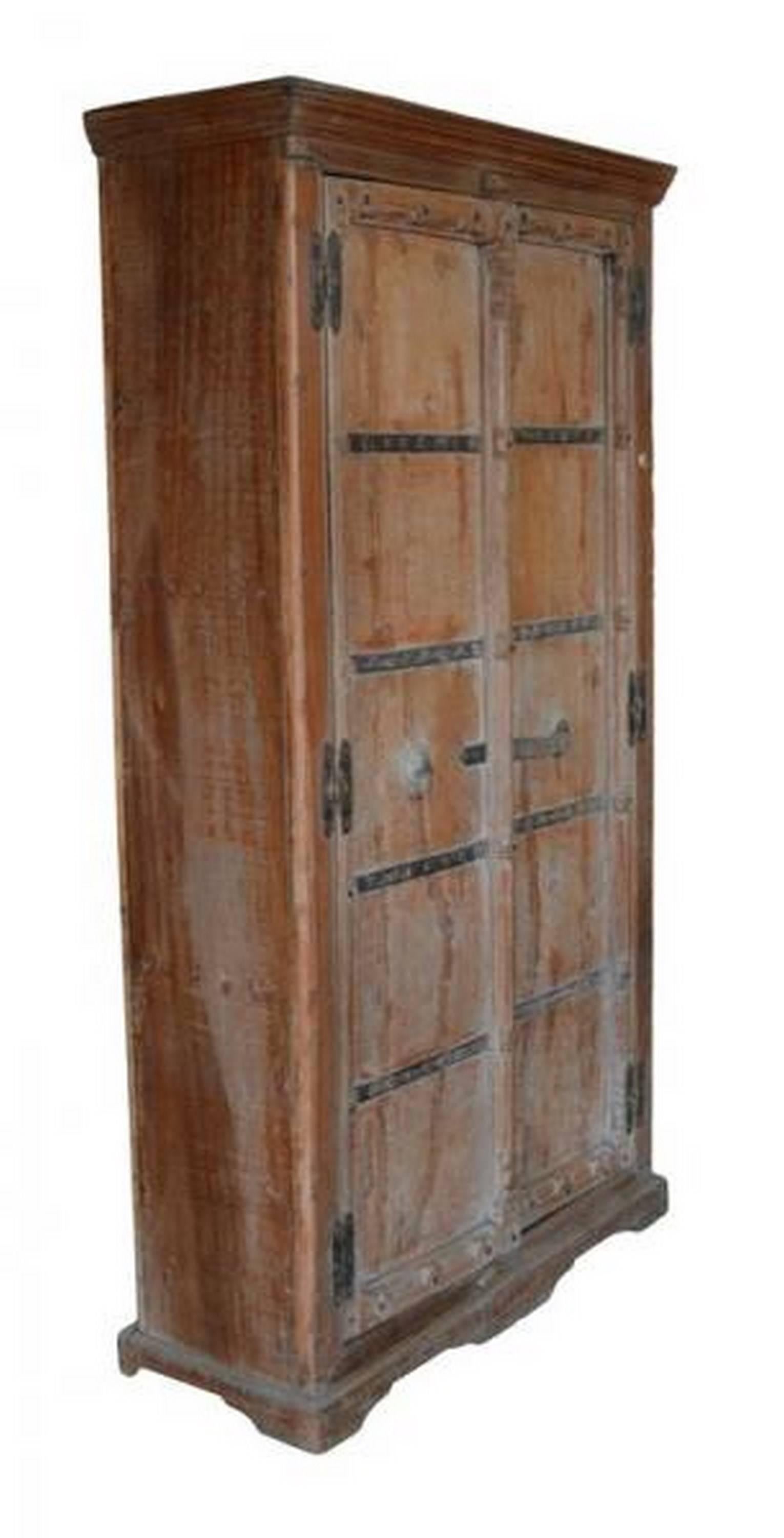 A 19th century Indian Shesham wooden two-door cabinet with iron hardware. This tall wooden cabinet from the 19th century made with Shesham wood and iron hardware comes from Gujerat in India. This cabinet features a molded cornice and a carved base.