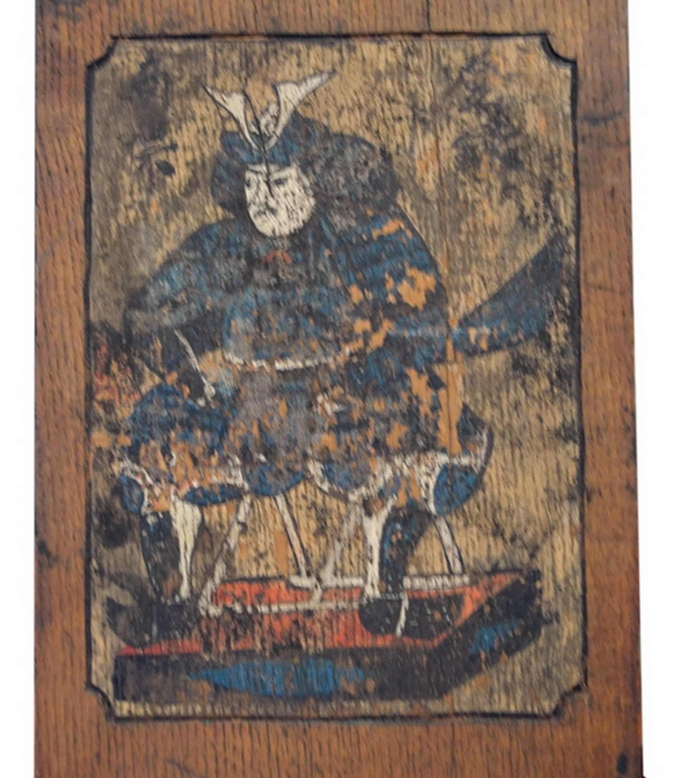 A Japanese carved and painted wooden sign with a Samurai from the Meiji Period, 19th century. This 19th century sign with a samurai was made in wood and painted in Japan during the Meiji period. The narrow rectangular panel features a painted frame