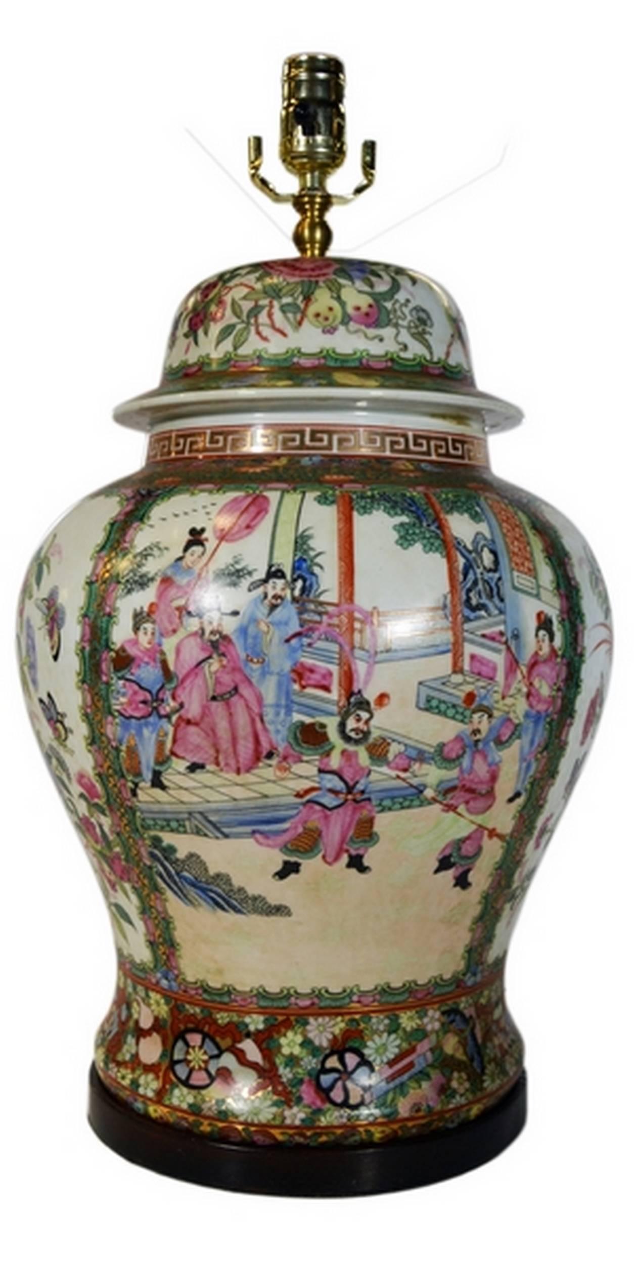 A vintage Chinese porcelain lamp showcasing a hand-painted flower and birds scene. This lamp adopts an elegant and typically Chinese bulbous shape and is decorated with a variety of scenes. One side displays a flower and bird composition, both of