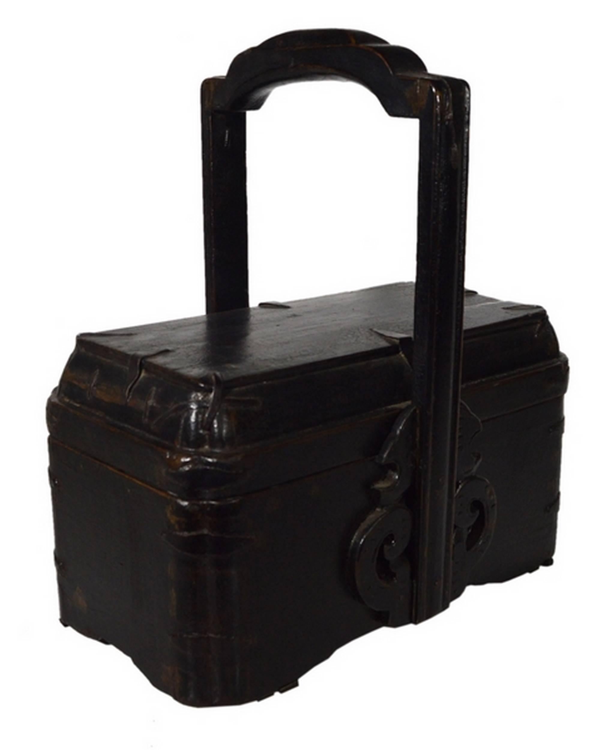 A Chinese 19th century basket hand-carved from elmwood with many details. This rectangular basket adopts a rounded carved shape and features a tall rounded carved handle at its centre. The two largest sides showcase hand-carved scrolls abutting the