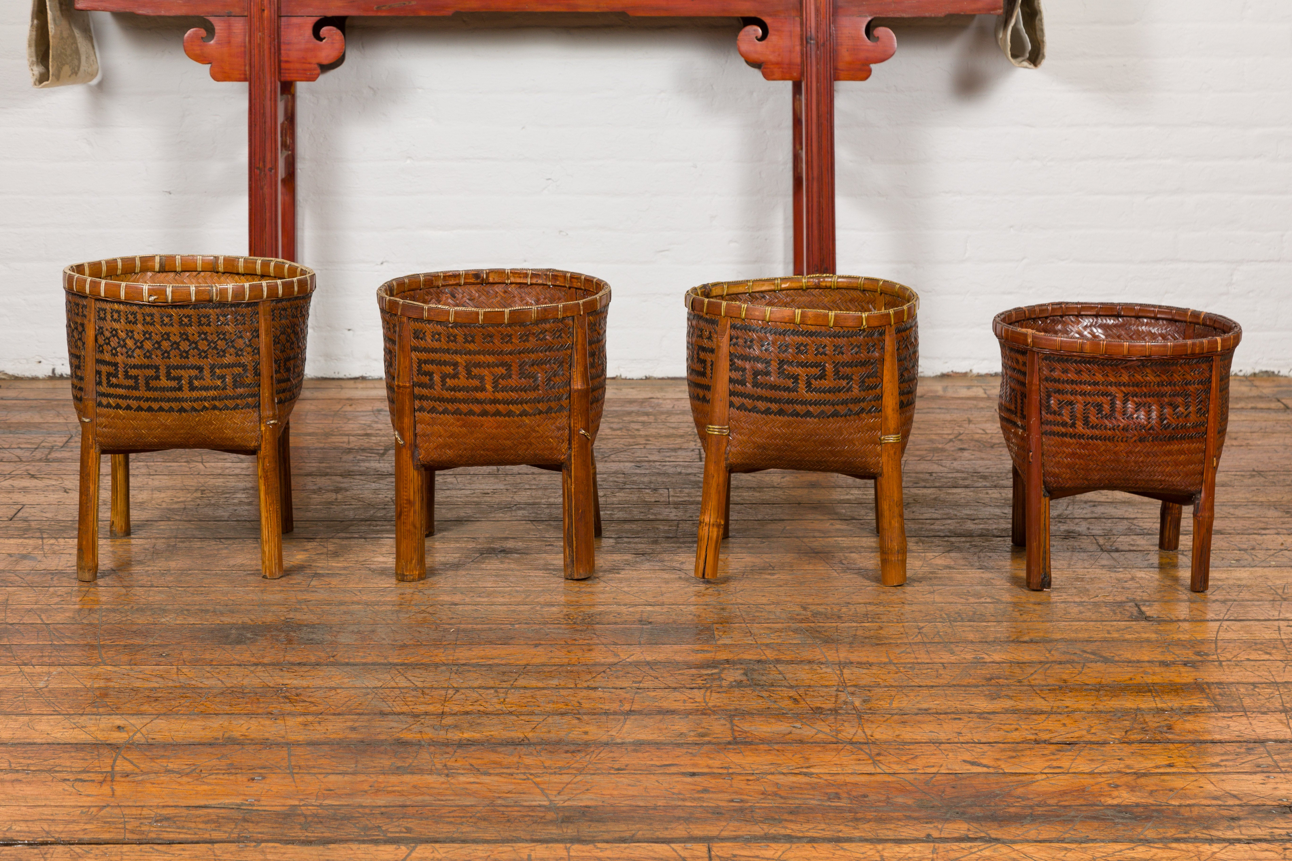 Woven Rattan Baskets on Legs with Greek Key Motifs, Four Pieces Sold Each For Sale
