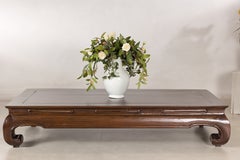 Chinese circa 1900 Elm Low Kang Coffee Table with Scroll Feet and Panel Top