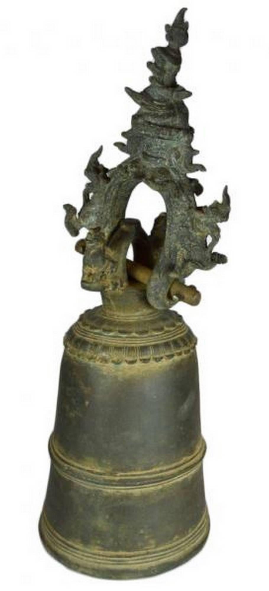 An elaborately decorated 18th century bronze bell from Burma. This bell features a tall belly with three decorative rings, the top ring featuring petal motifs. The bell can be hung thanks to a ring displaying a rich foliage and lion adornment and