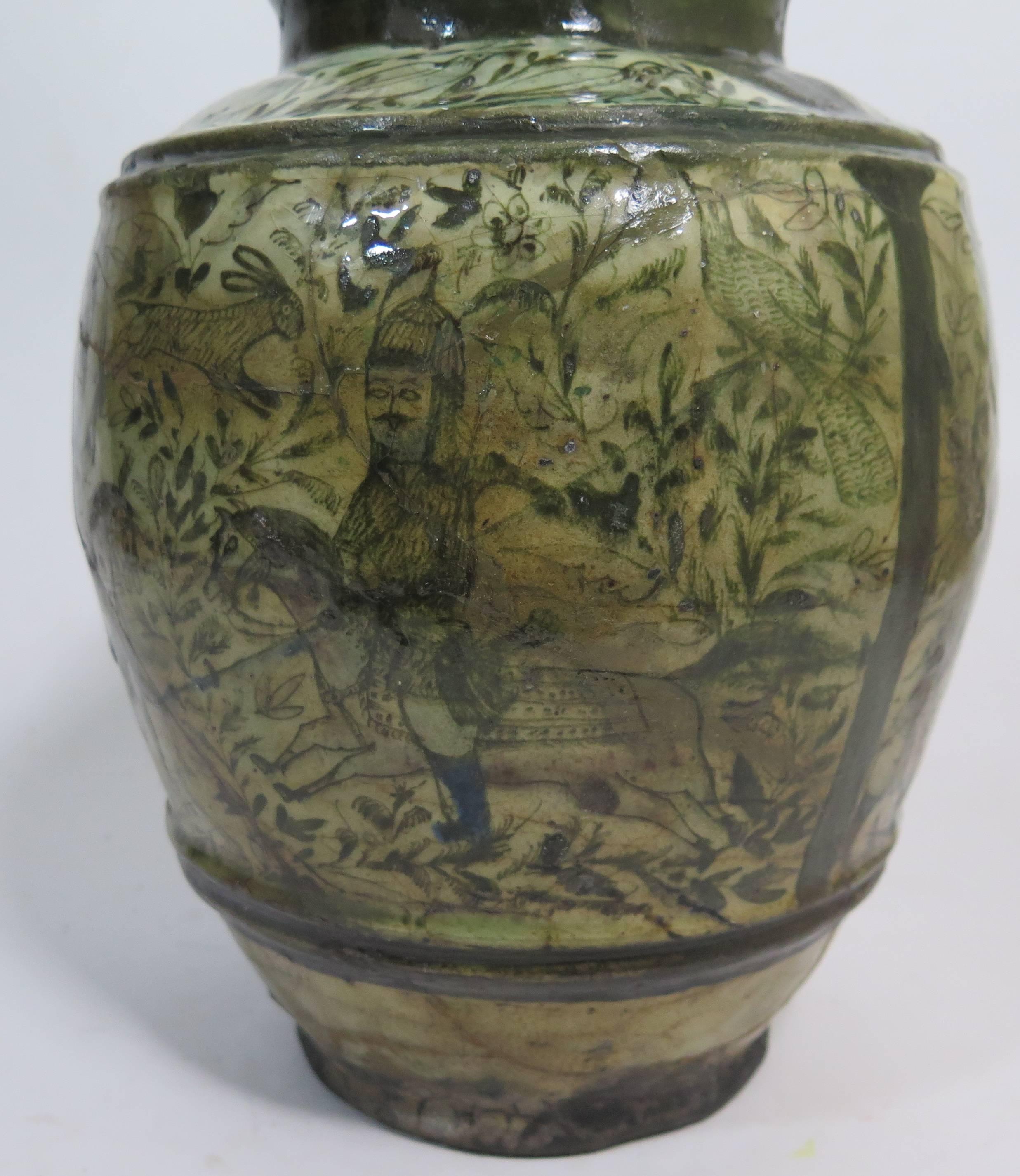 Beautiful and very early Persian ceramic jar. Hunting scenes and animal figures throughout. Old repairs throughout.