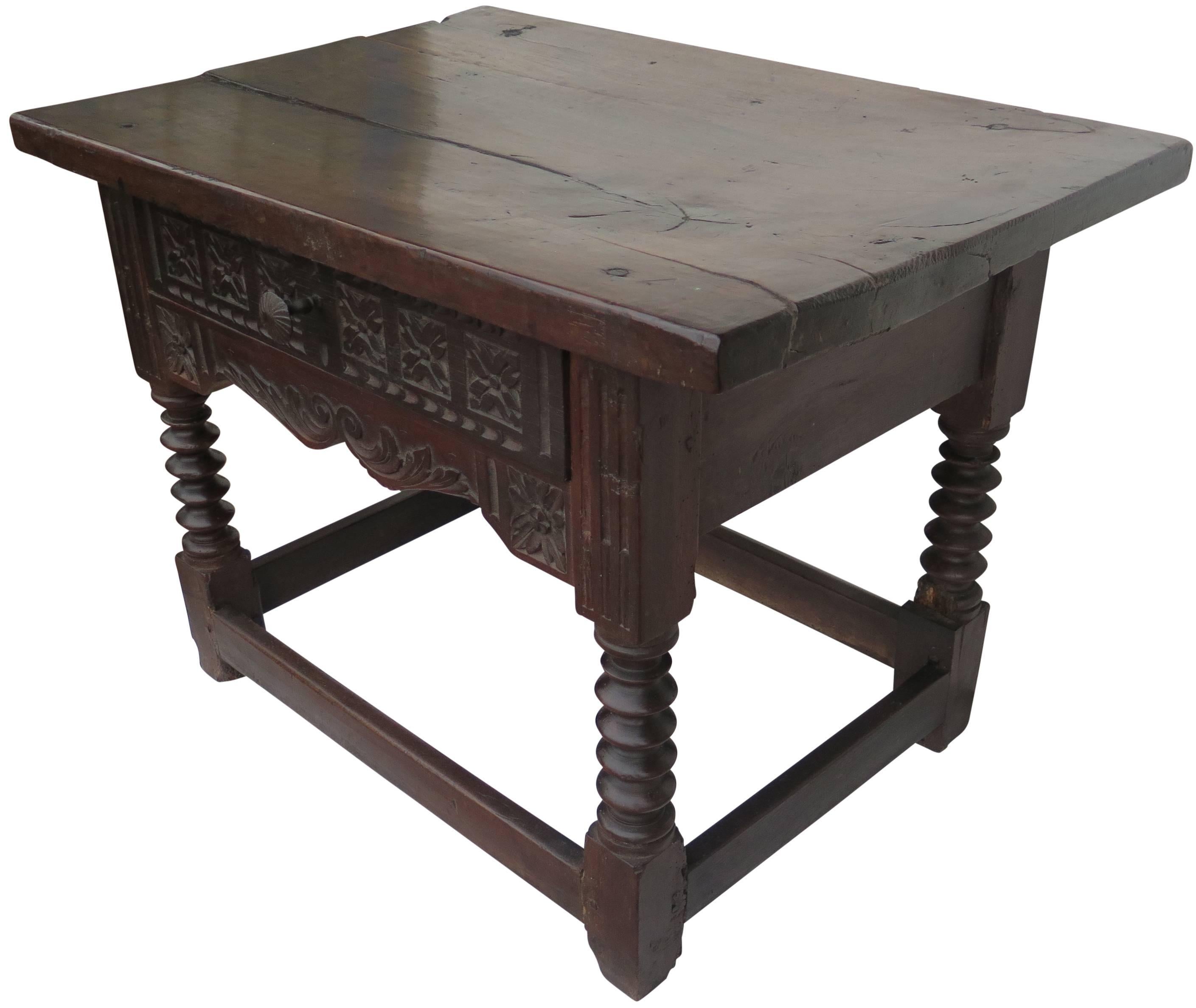 Nice 18th century Spanish side table with ice slab top. Carved drawer and turned legs.
