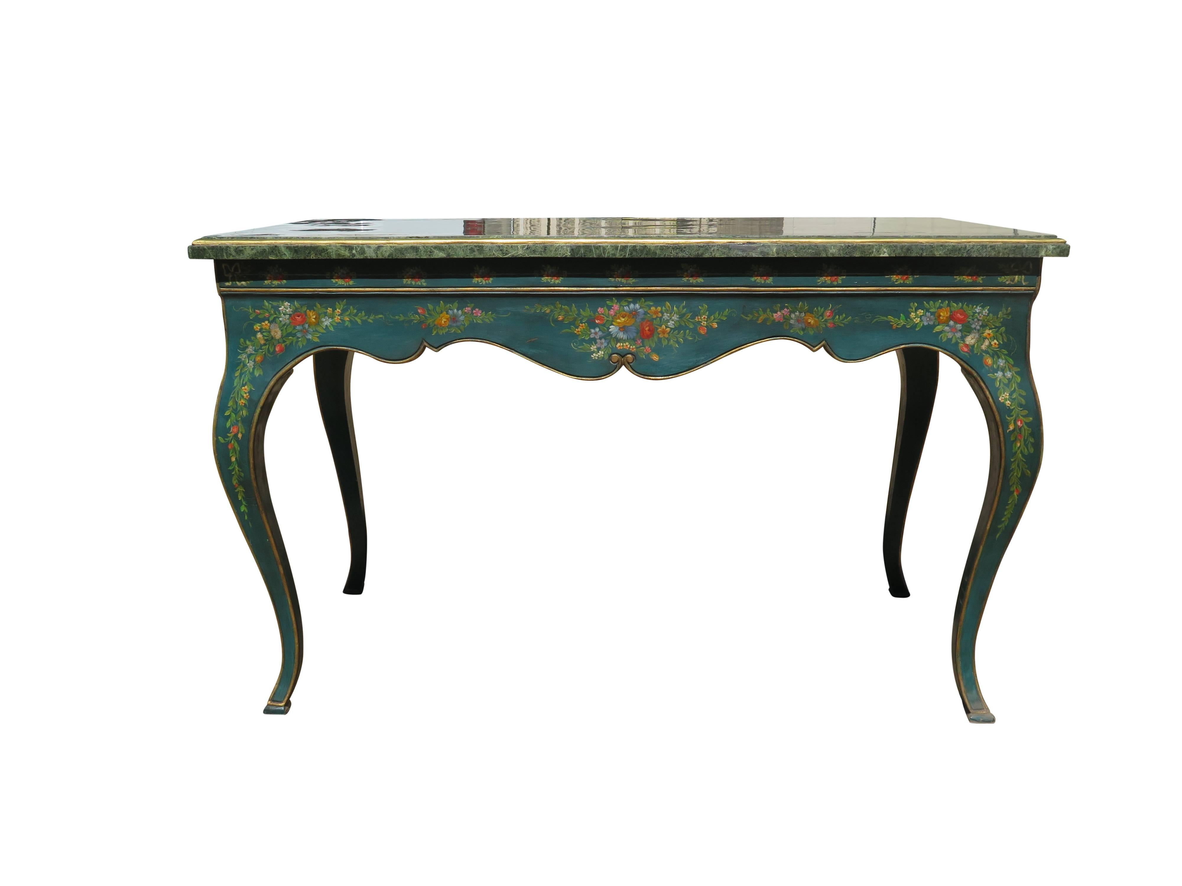 Very attractive english table with teal blue legs and apron and greenish marble top. Floral designs painted throughout.