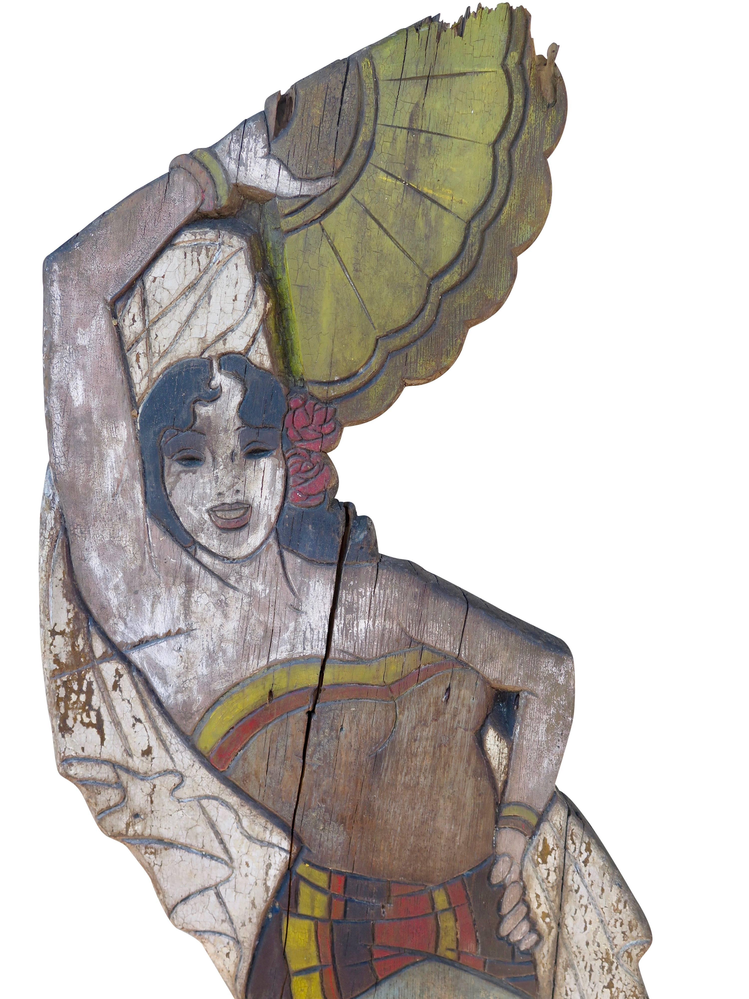 Likely from the 1930s, this life-size sign features a painted Spanish dancer on wood.