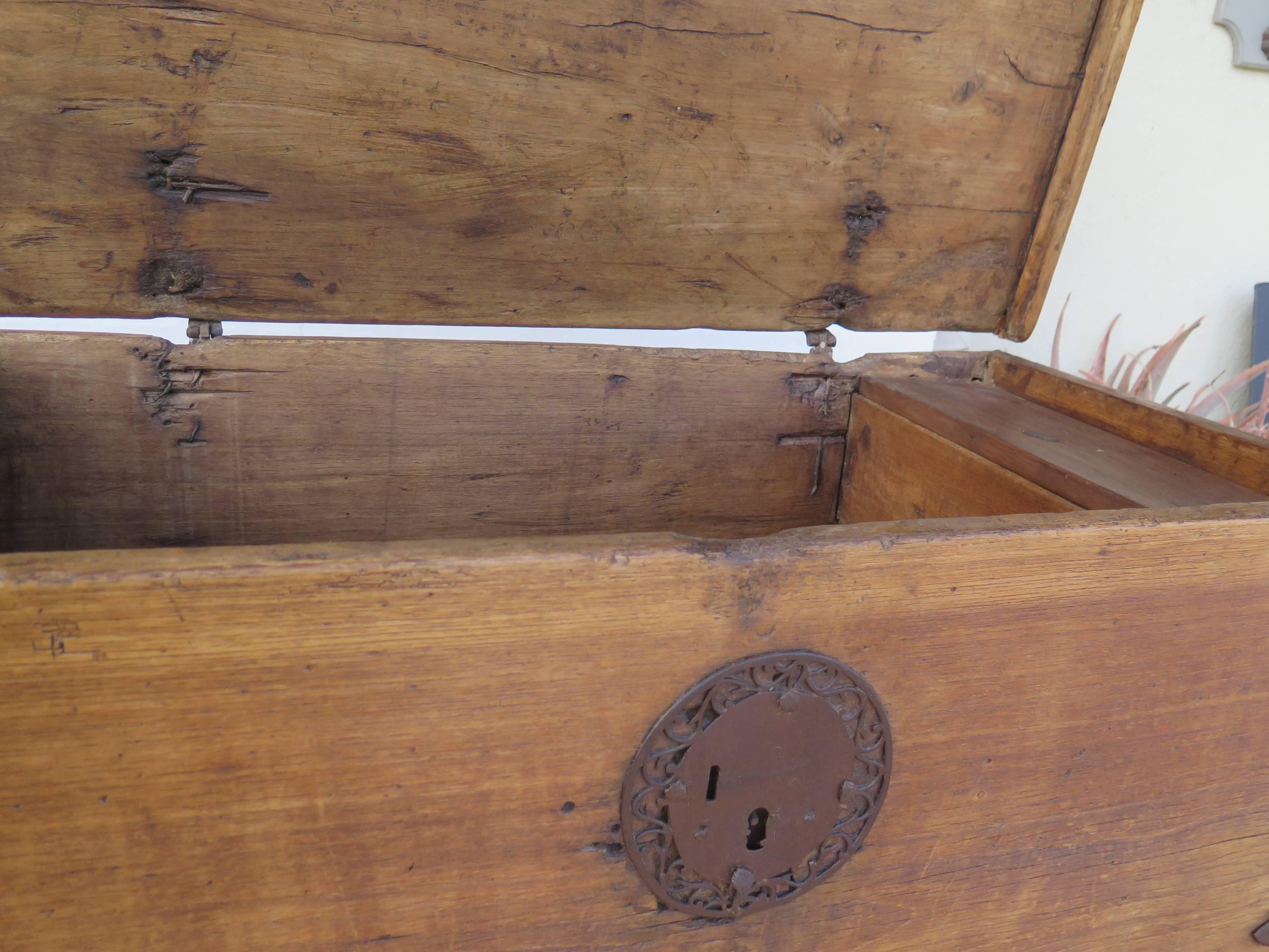 Beautiful Spanish colonial Mexican Sabino wood chest on iron stand. Original hardware. Dovetail on corners. Lift top with interior box.