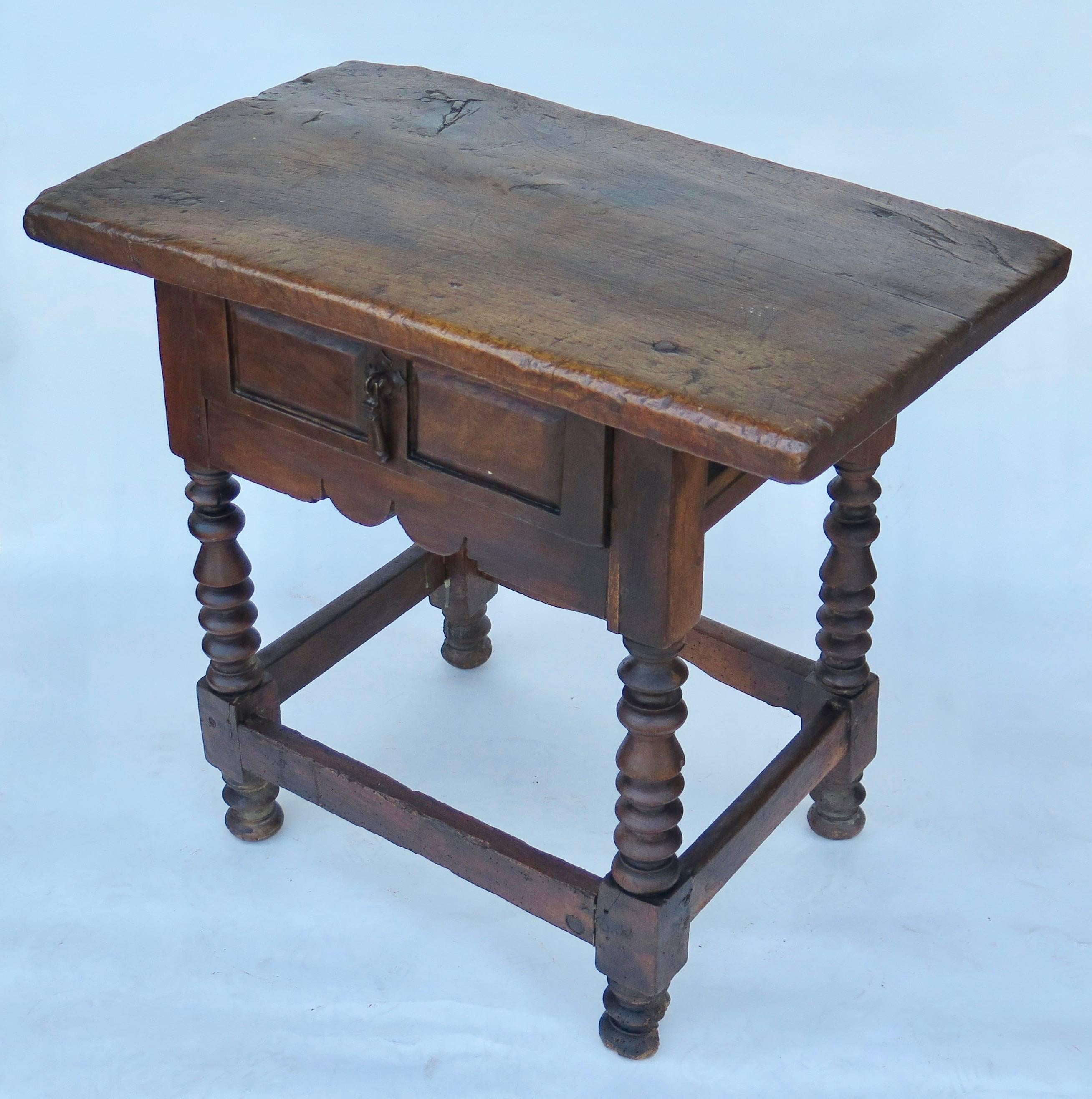 Excellent early Spanish side table with turned legs and single plank top.