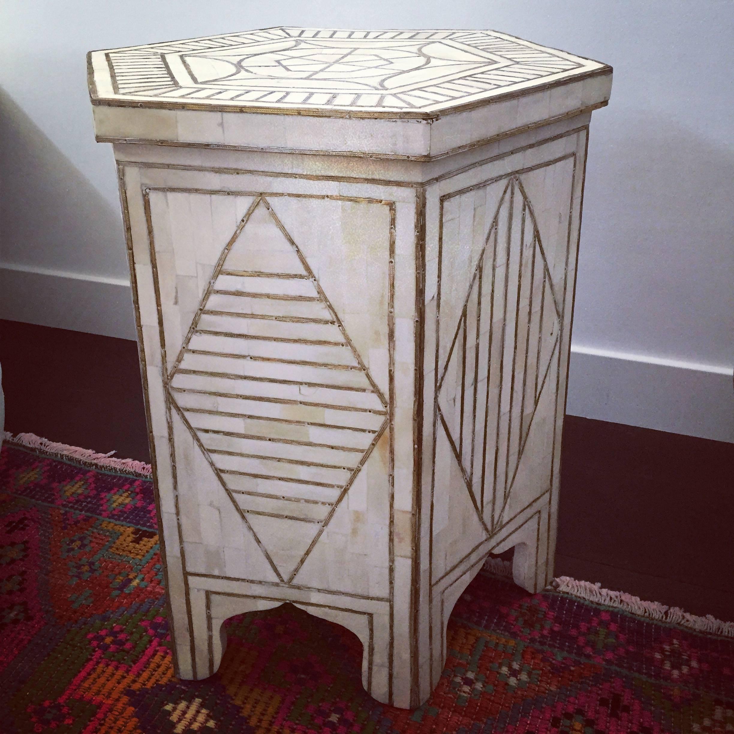 Geometric design table with bone inlay and brass.