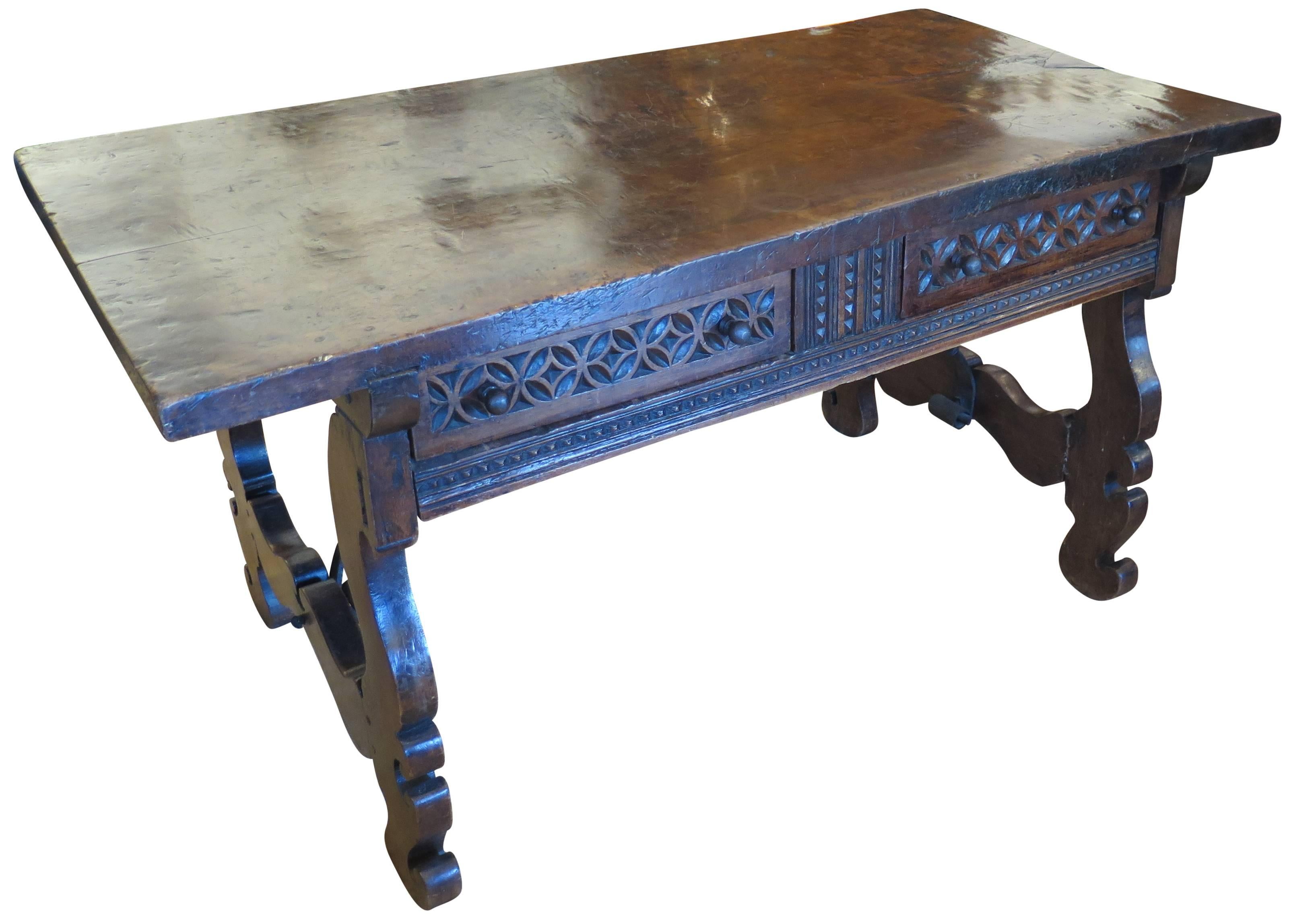 Fantastic walnut period table with fantastic walnut slab top. Moorish designs and elements on front doors. Iron stretcher and lyre leg base.