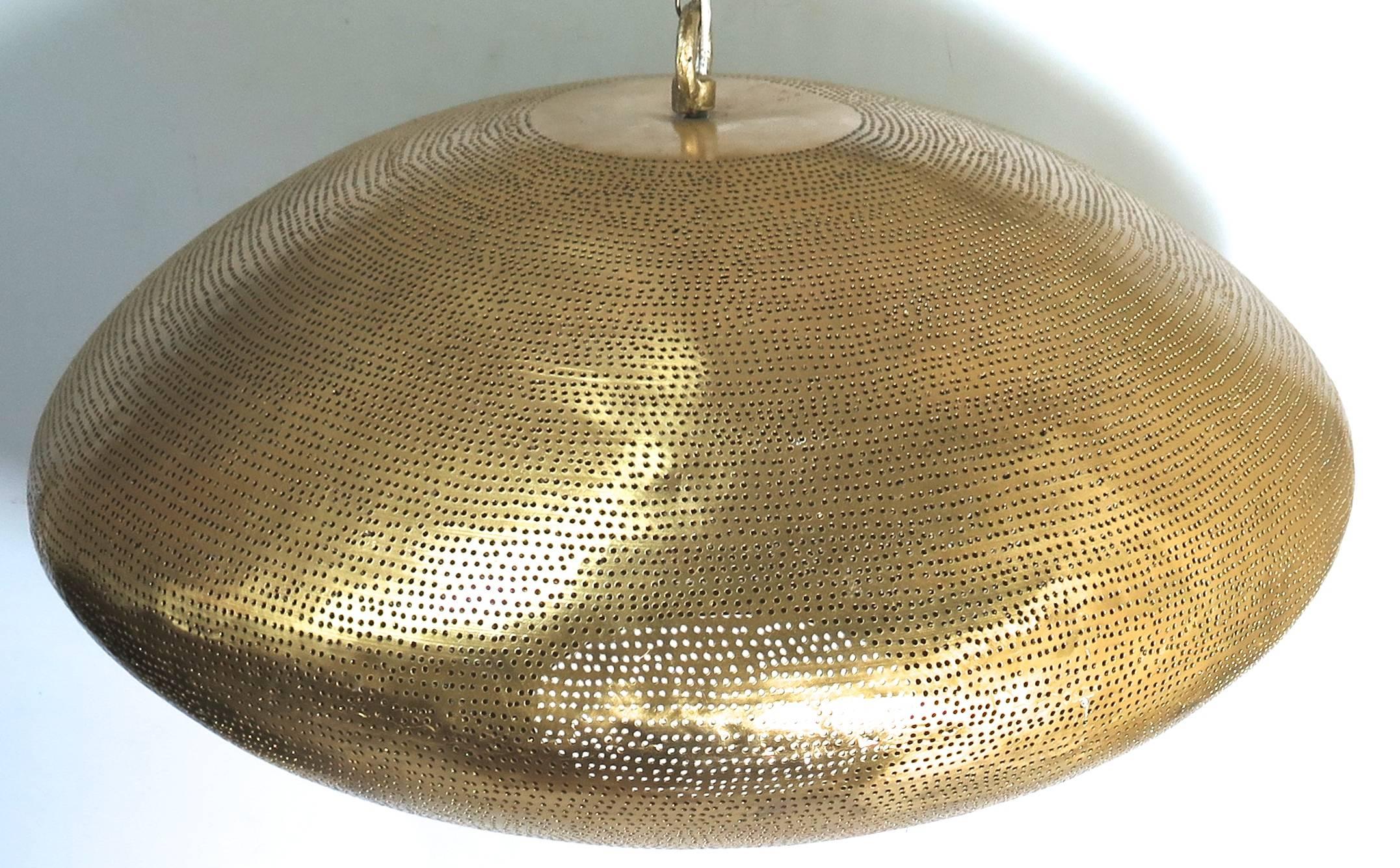 Brass fixture with pierced holes. A modern shape that creates an interesting light. Available in custom sizes. Pictured 21