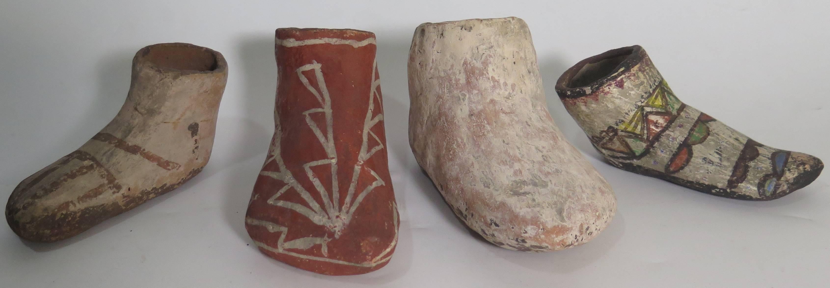 Excellent group of early pottery moccasins.