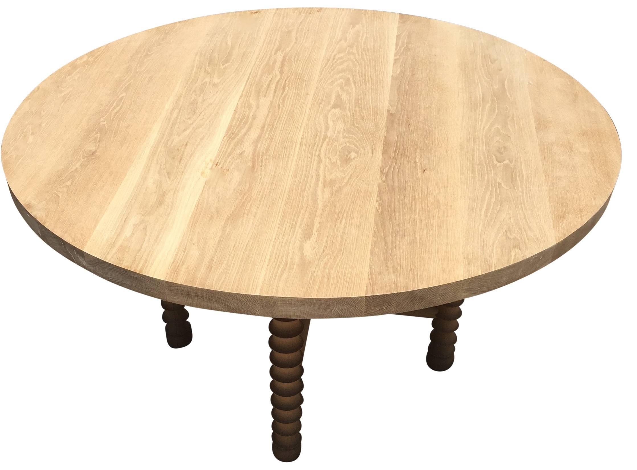 The Ojai dining table melds contemporary and transitional design elements. Shown in white oak, it is also available in walnut and alder. It is also available in a charcoal, Black and dark brown finish. Custom sizes available with a six-ten weeks