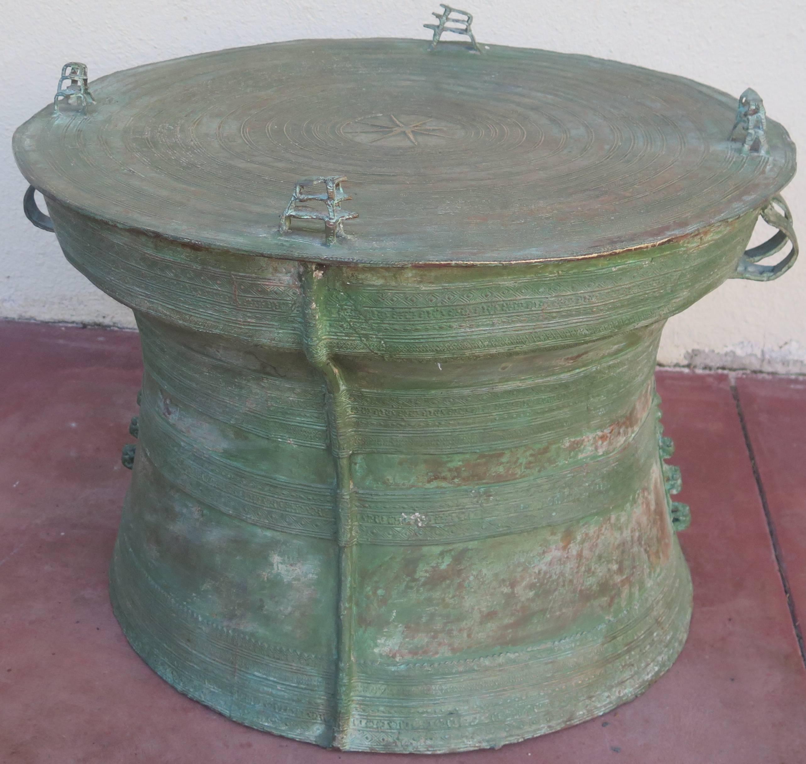Large and beautiful bronze rain drum from Southeast Asia. Green verdigris throughout the drum. 19.5" high at top of frogs.