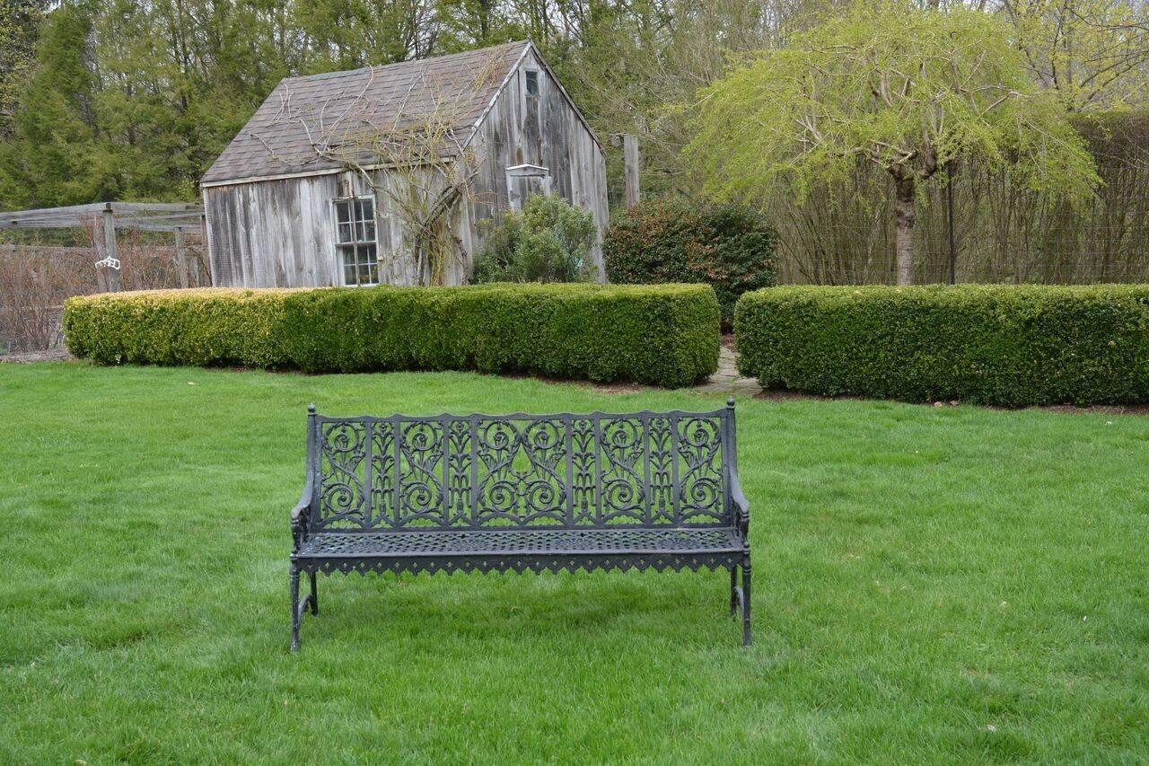 An unusual cast-iron curtain-style garden bench with scalloped and beaded apron, leafy scrollwork, stylized floral elements, and simplified Gothic motifs, American, circa 1900. Measure: 34.75 ins. high, 63.75 ins. wide, 20.5 ins. deep.
This pattern