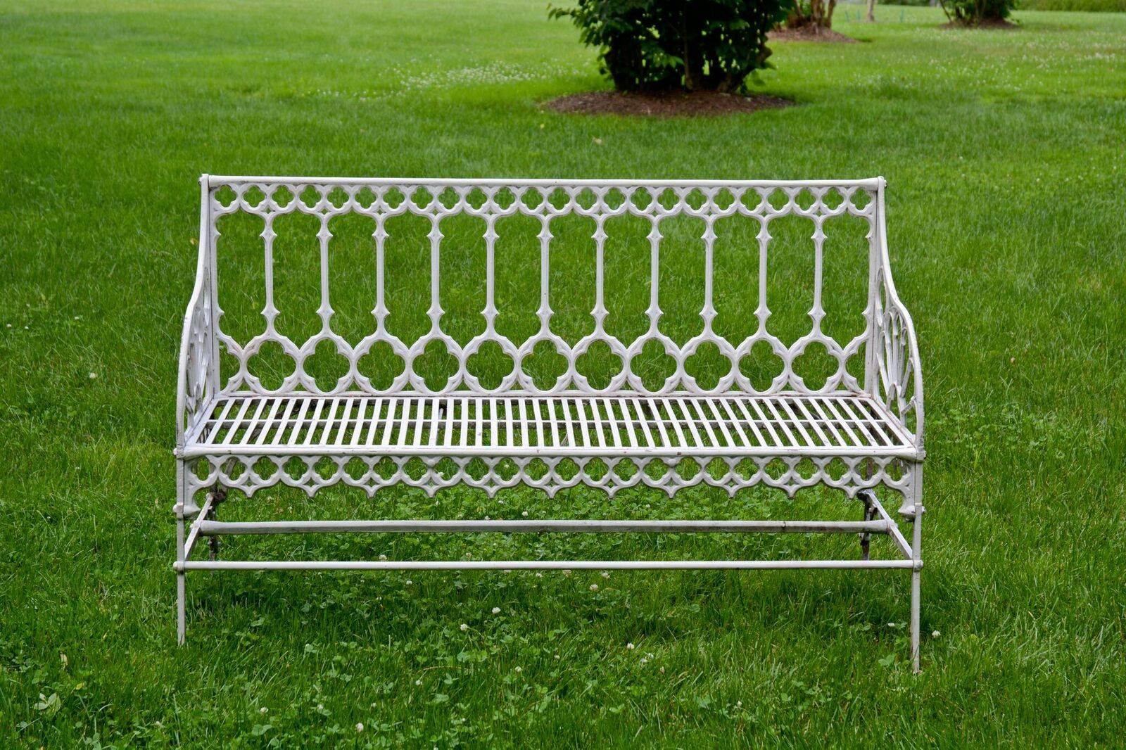 A cast-iron seat in the Gothic style, with pierced seat, tracery on back and apron and radiating semi-circular pattern at arms, nearly identical to seat produced by the Val d’Osne foundry, but with a slimmer, finer Silhouette, possibly Scottish,