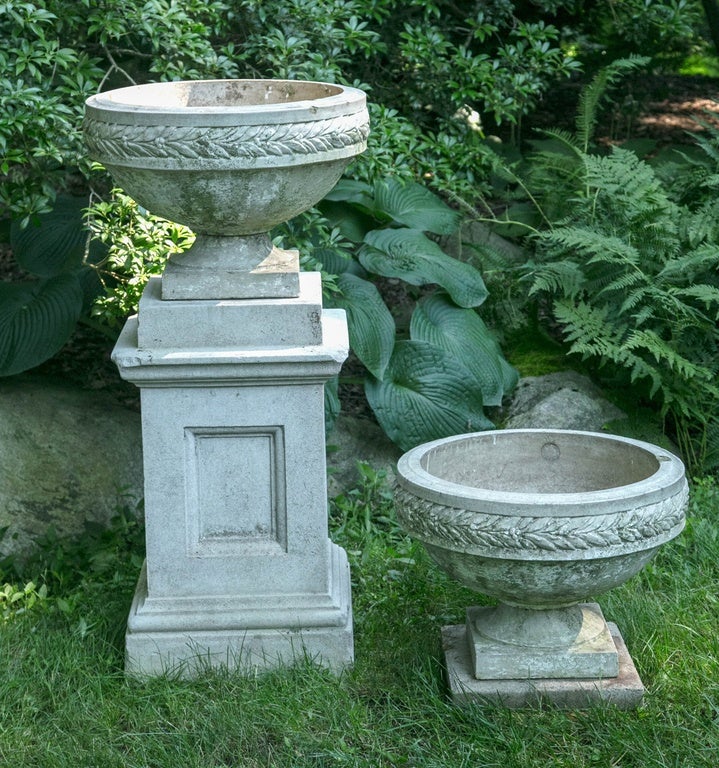 A pair of stoneware planters stamped “412” and “GALLOWAY POTTERY PHILADELPHIA [inscribed in a circle]”, of tazza form ornamented with a laurel leaf frieze.