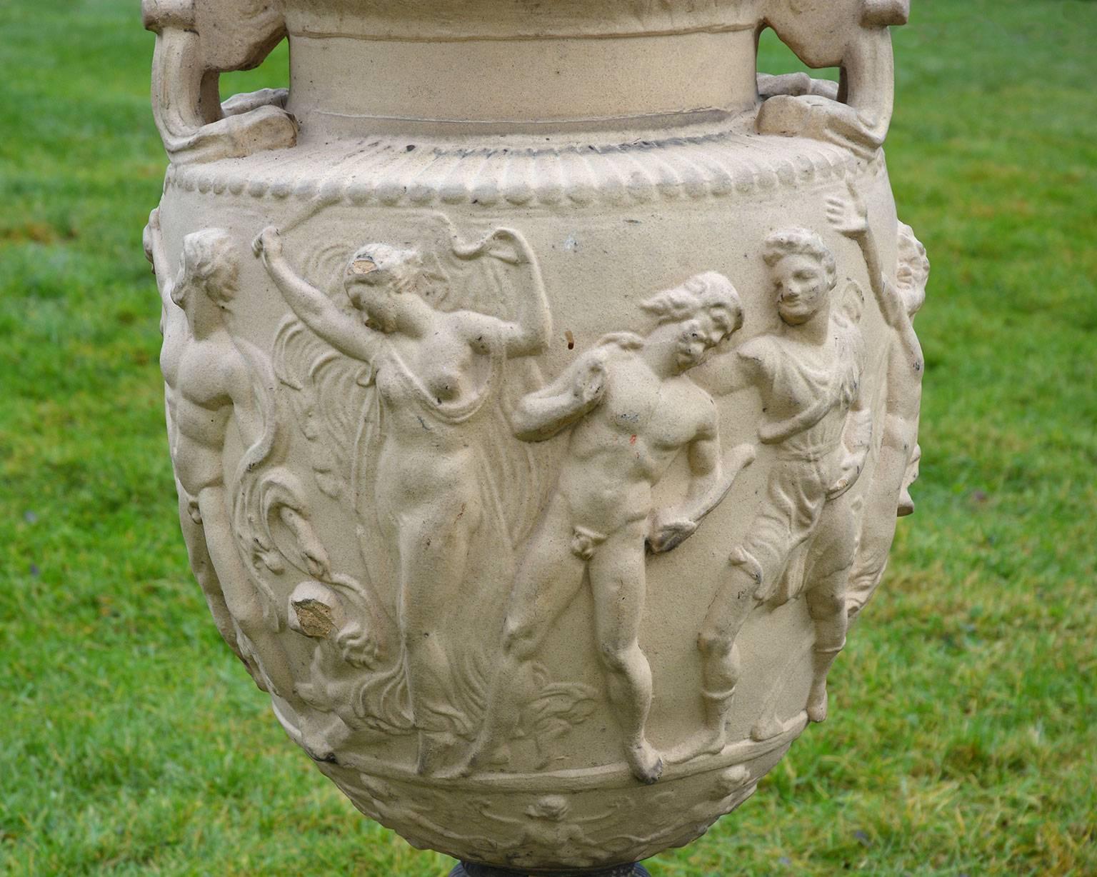 A very fine pair of stoneware urns after a first century-B.C. marble original known as the Townley Vase, marked “GALLOWAY POTTERY PHILADELPHIA”.  35 ins. high, 21 ins. overall width, 12.5 ins. square at base. 

Literature: No. 183 in the Galloway