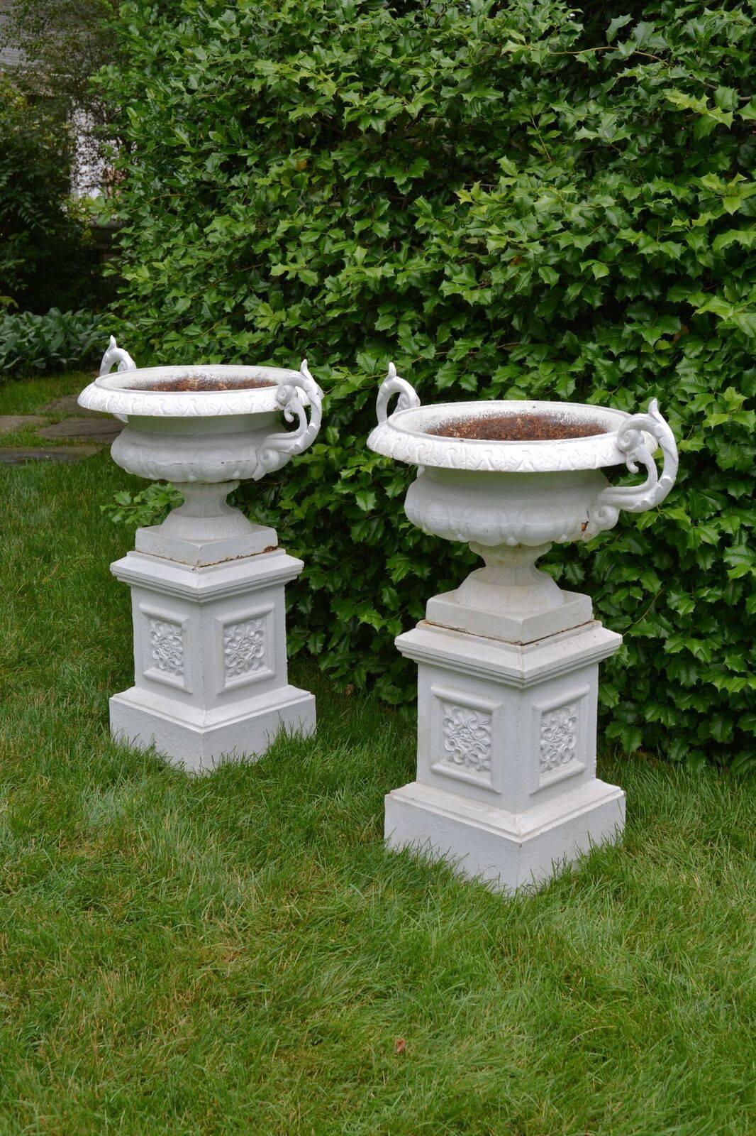 Victorian A Pair of White Painted Cast-Iron Urns on Pedestals