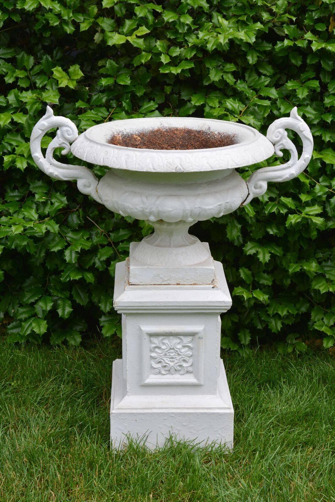 A Pair of White Painted Cast-Iron Urns on Pedestals In Good Condition In Katonah, NY