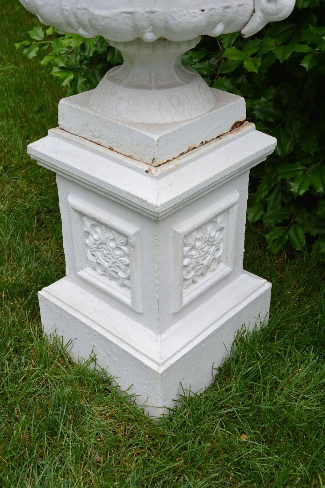20th Century A Pair of White Painted Cast-Iron Urns on Pedestals