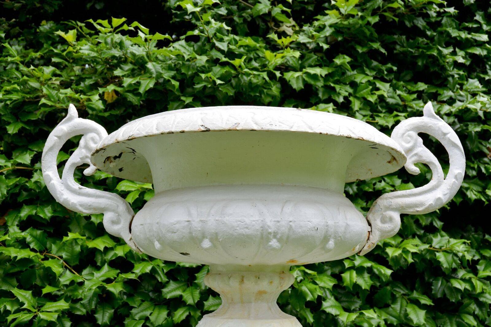 A Pair of White Painted Cast-Iron Urns on Pedestals 3