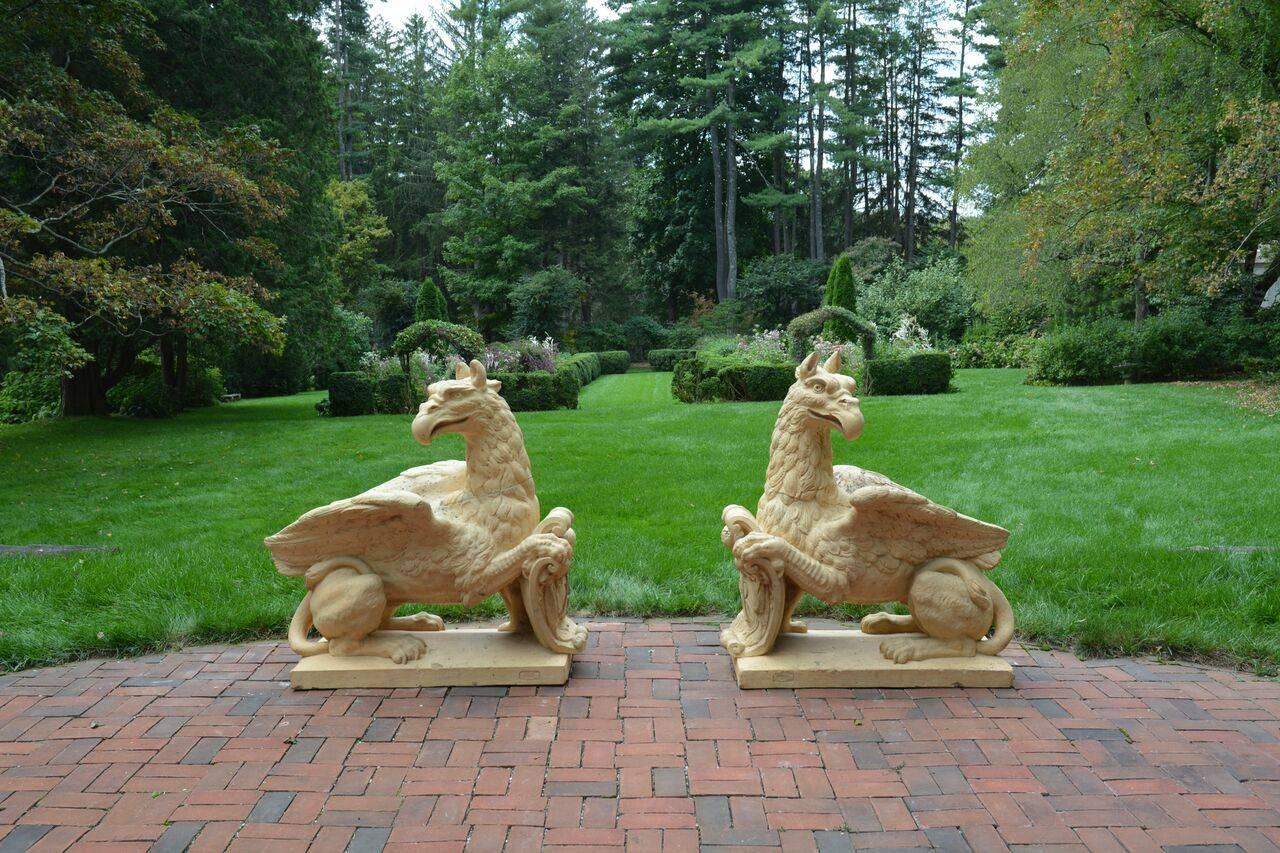 A pair of impressive terracotta griffins with forepaws resting on shields with monogram “AR”, marked “Virebent Fres [Frères]/Toulouse/Propriété”, French, circa 1860. Measure: 44 inches high, 44 inches long, 24 inches deep. This model, no. 806, is