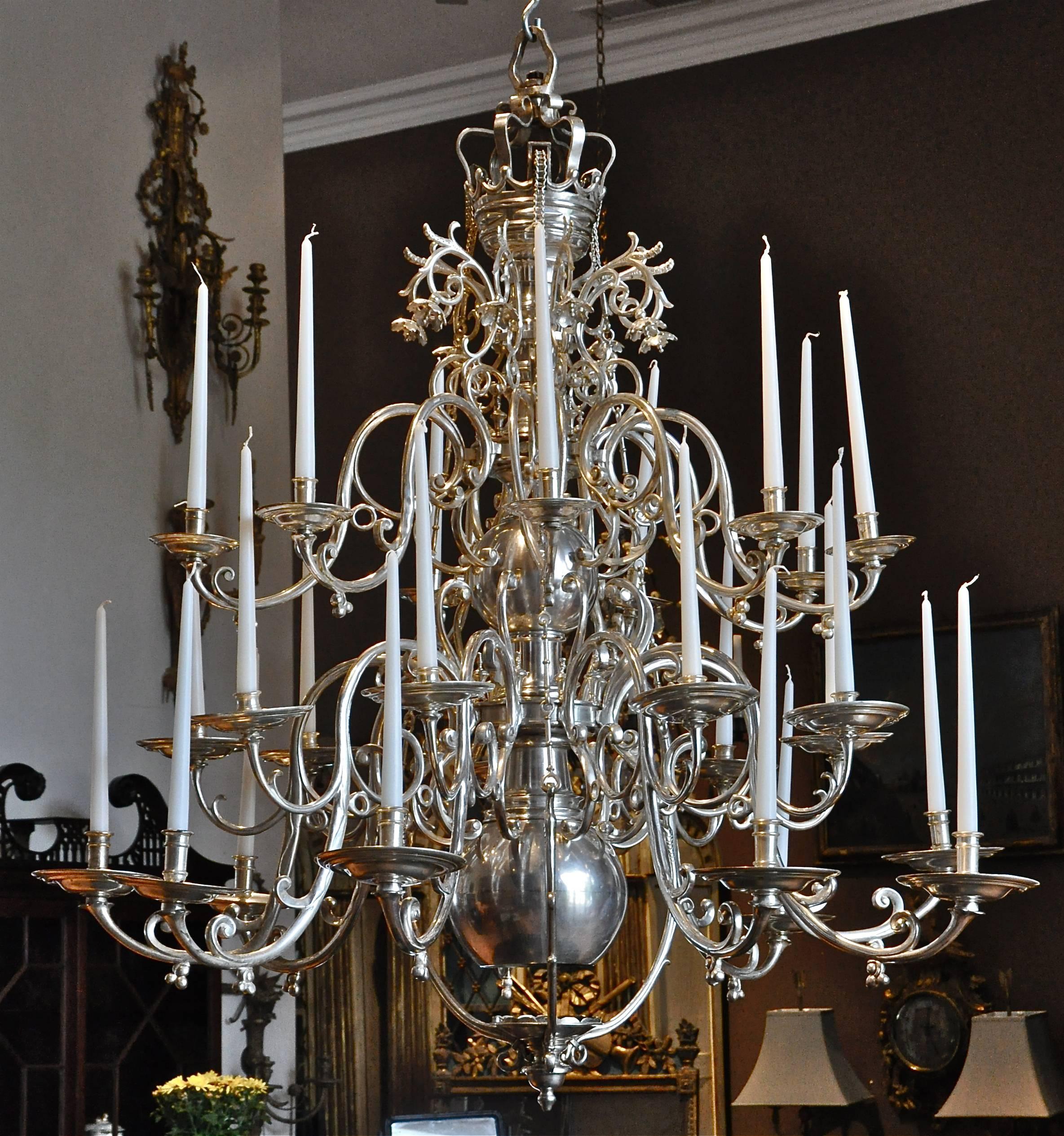 Period 18th century Baroque chandelier in nickel silver, most likely Wurzburg

Remarkable discovery.
Retains its original censor which can be lowered and raised by three chains allowing incense to travel through baluster shaft and out crown