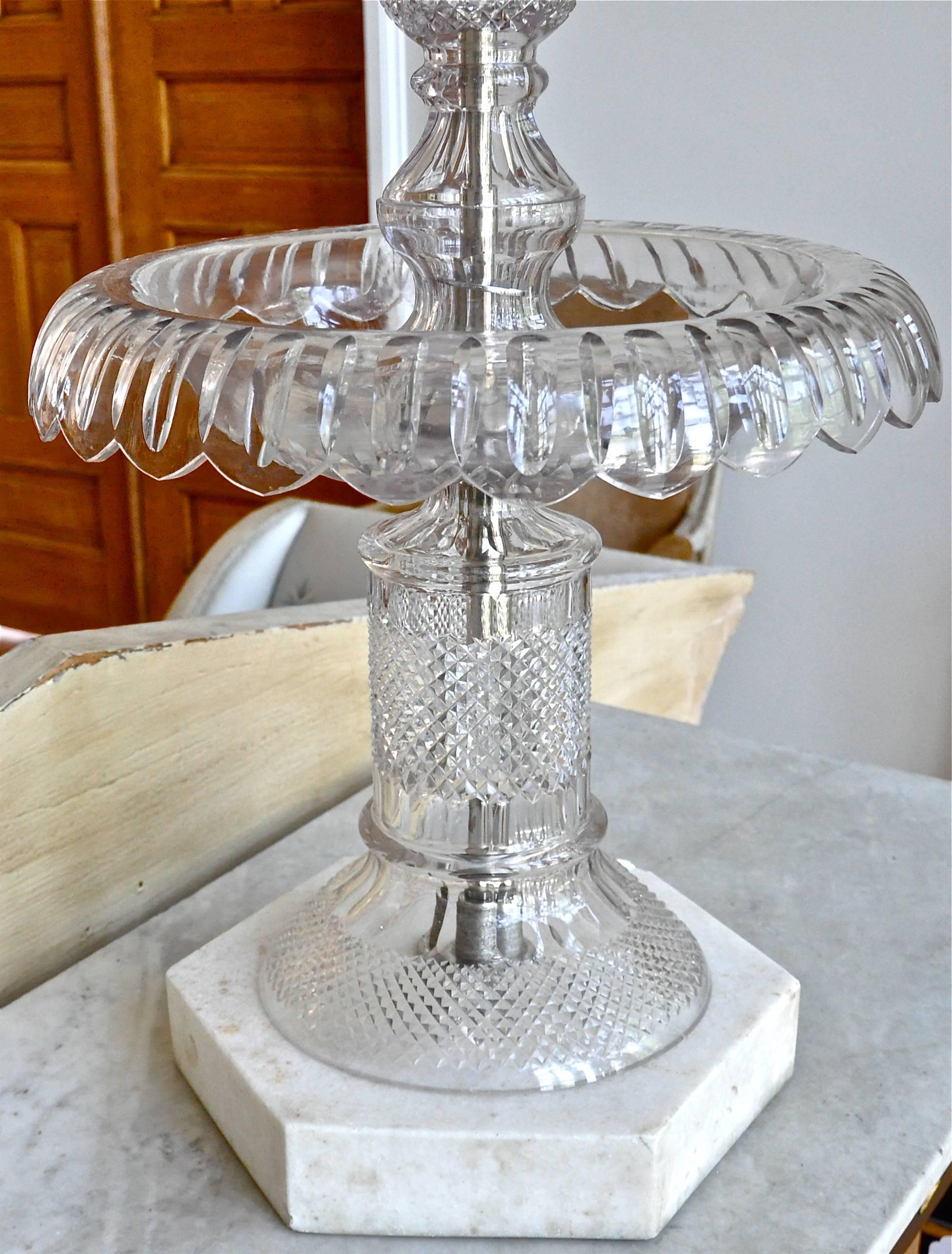 Rare and monumental crystal table fountain attributed to baccarat

Three-tiers of blown and cut crystal, signature Baccarat-style diamond cut
Marble base
Can be used as an epergne however, was most probably a champagne fountain
A 