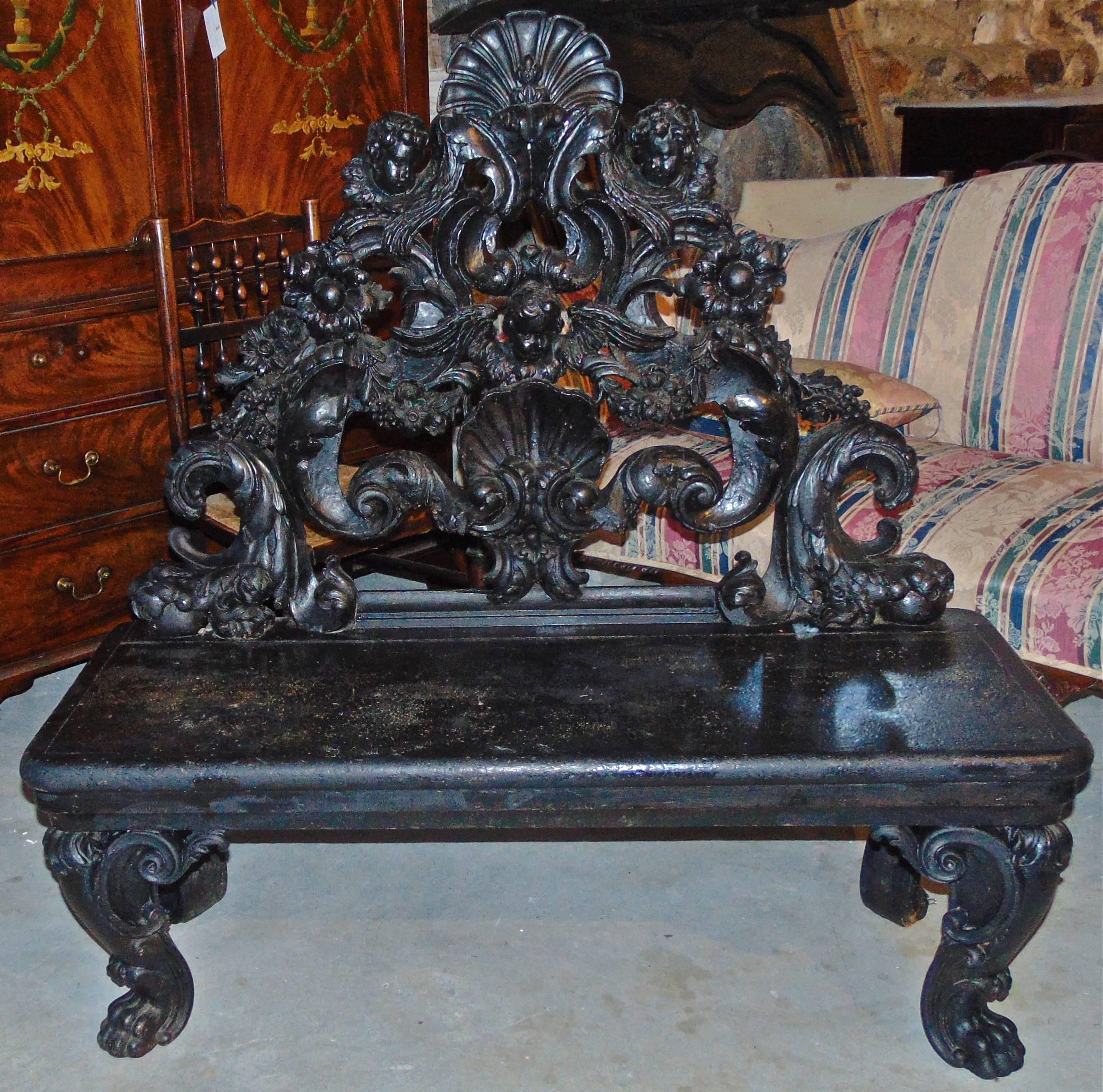 Period Italian Baroque carved panel incorporated into a bench or settee.

Carving used as back is 17th century/seat and legs early 19th century.
Pure Baroque.